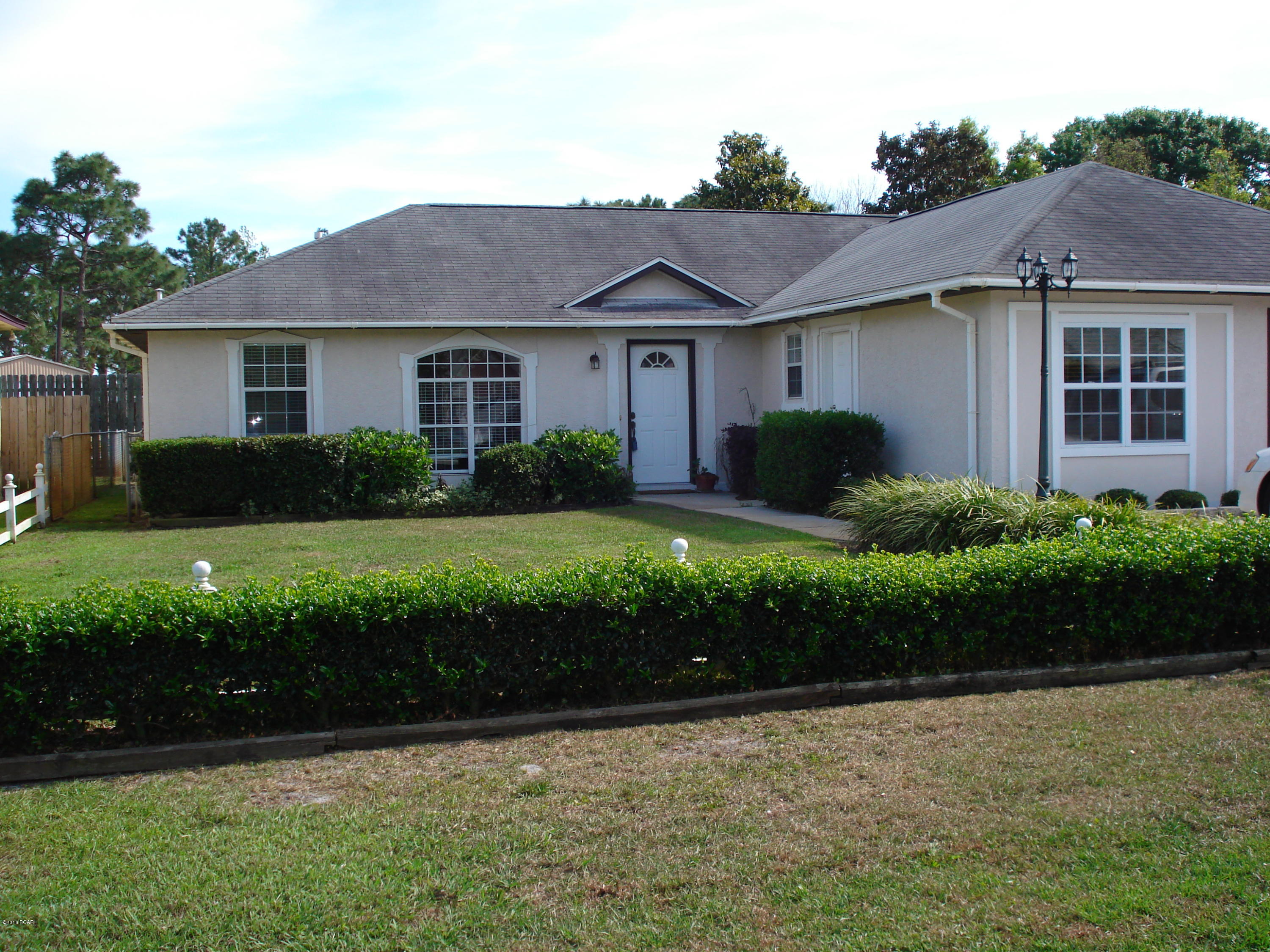 Three bedrooms two baths and additional bonus room or office and one car garage. The backyard is privacy fenced and a haven of lush fruit trees - oranges, peaches, figs beautiful green grass and a patio just off the master bedroom. Master bedroom has sliding glass doors to enjoy all the beautiful back yard has to offer. This home is centrally located in a quiet neighborhood - not a through street and a spring fed lake view across the street. This home is a must see. One year lease.
