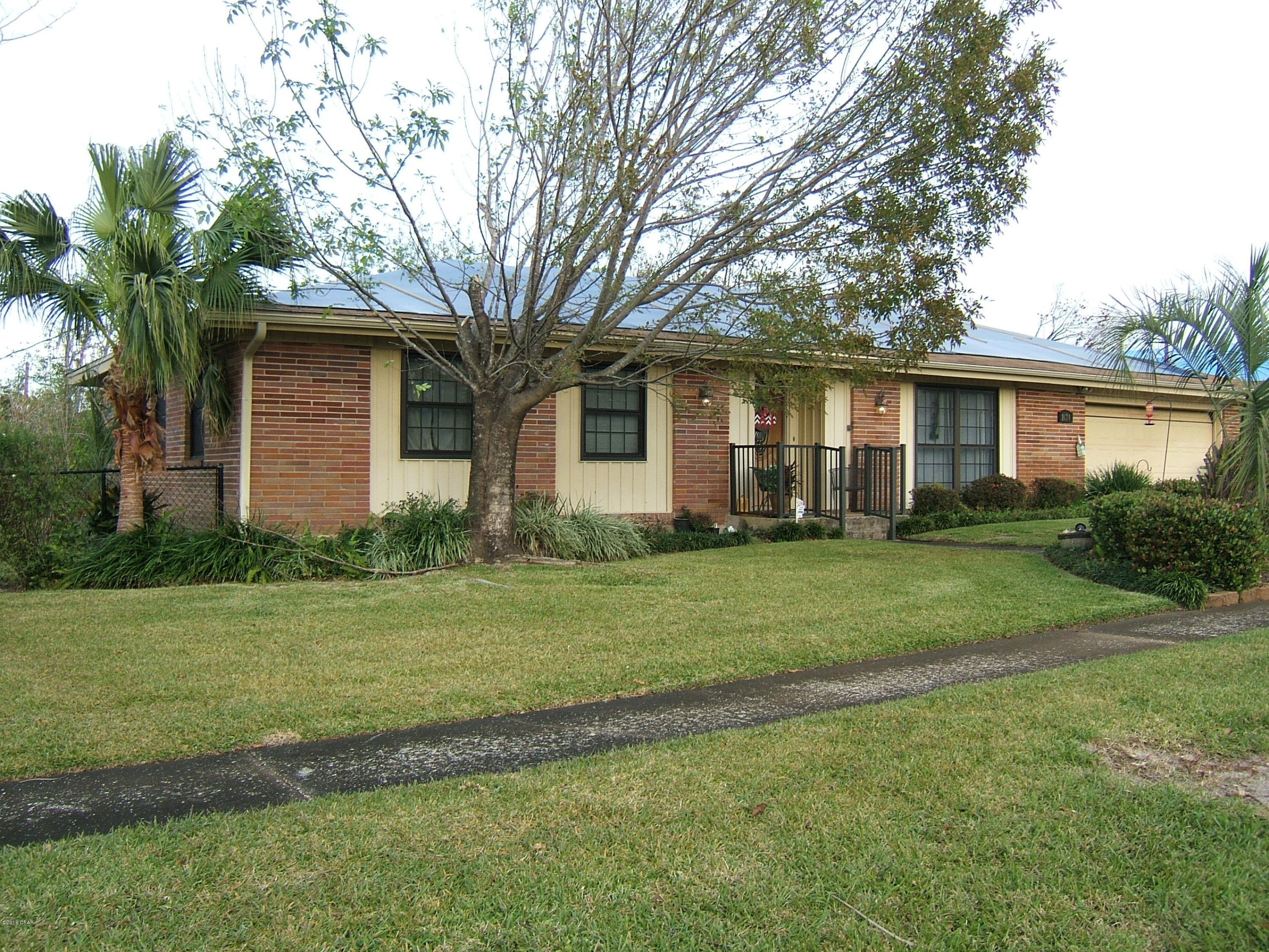 Well maintained Ranch style home located in a favorite neighborhood of locals. Four bedrooms and two bath , all updated with tile showers and countertops. Large immaculate landscaped fenced yard with screened porch in back for privacy. Extra driveway for motorhome or boat storage. Updates to home interior include synthetic wood flooring, tile baths, and corian countertops in kitchen No hurricane damage to home except shingles missing, roof to be replaced. Home is located near downtown shopping, schools and in a neighborhood already in recovery..