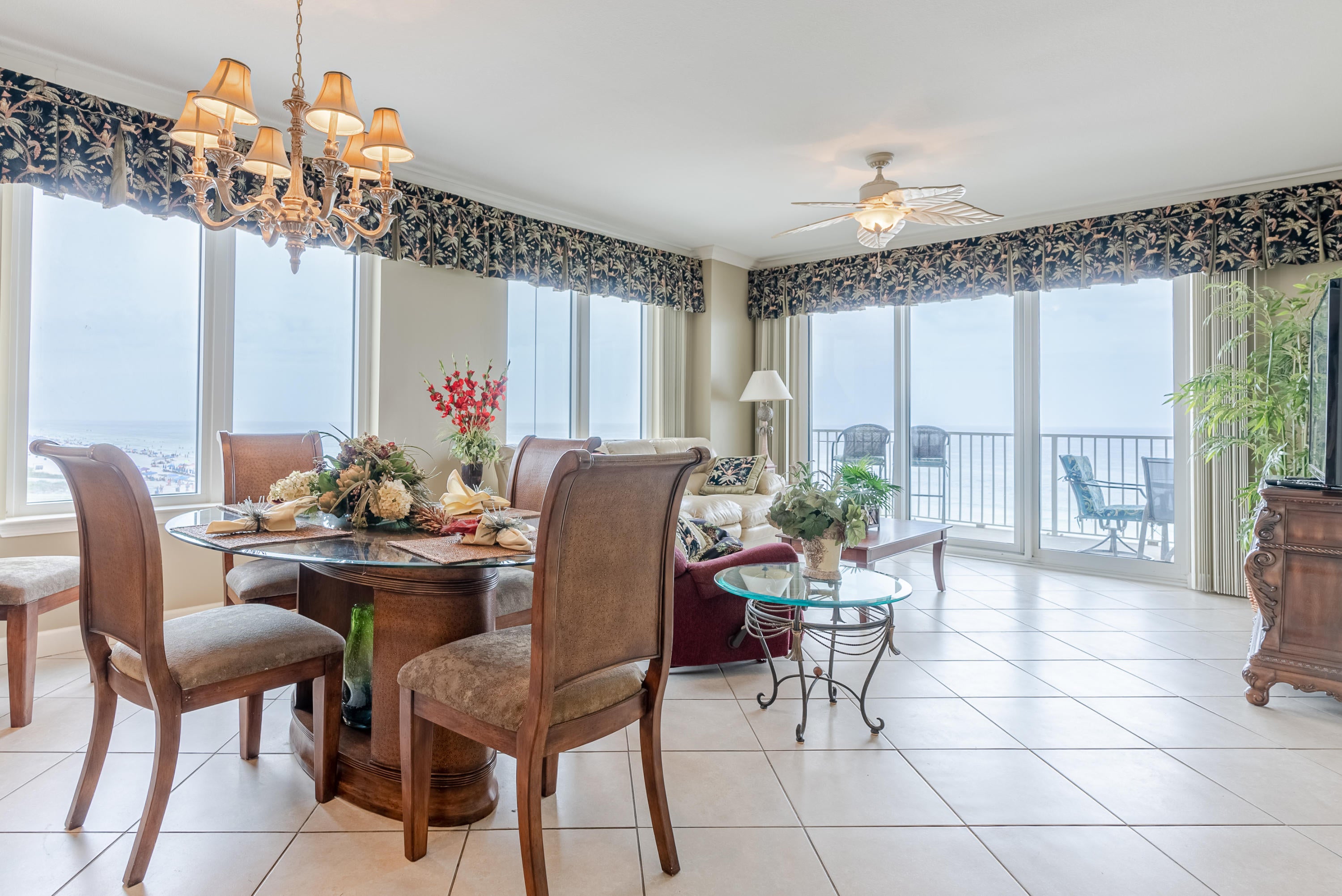 Beautiful Condo on the beach with a panoramic view from  the jetties on the East to Pinnacle Port on the West side.  Also this unit has a private balcony on the Northside from the North East Bedroom overlooking Front Beach Road.  This condo has high end furnishings and was decorated by a professional decorator.  Recently painted.  Granite Counter tops with a double sink , jacuzzi tub and separate walk-in shower in the Master Bedroom overlooking the Gulf.  It also has it's on private entrance from the bedroom to the balcony.  Bedrooms have their own full bath, with granite counter tops.   walk in closets in 2 bedrooms.  Large laundry room with a pantry inside the room.  Storm windows and storm doors replaced  since building was constructed.  New vinyl plank floors in the bedrooms.