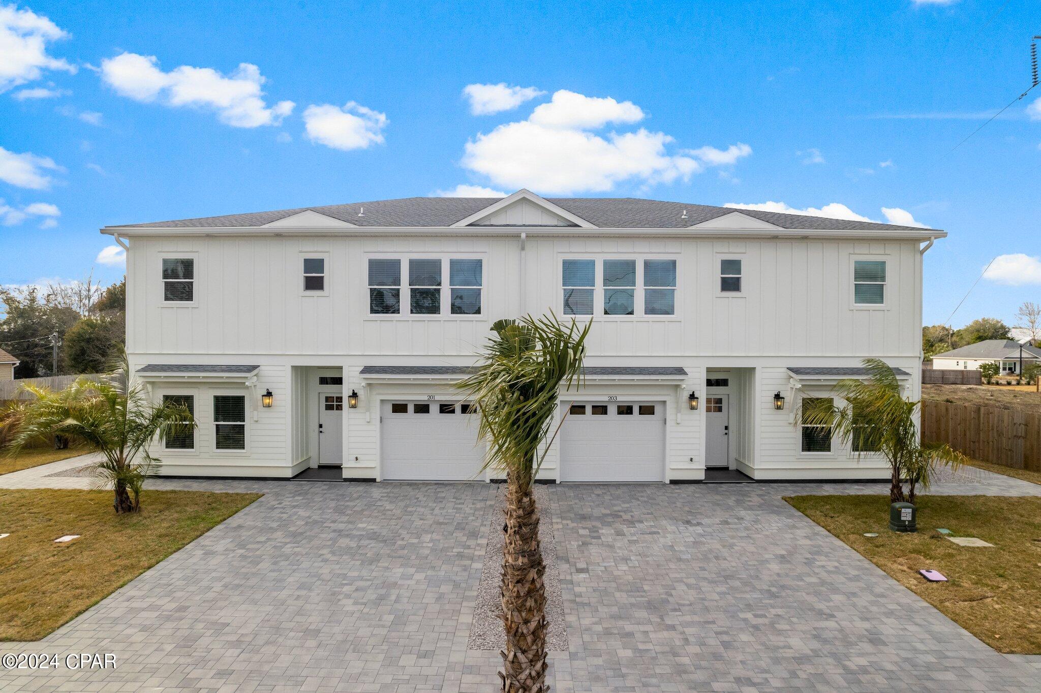 Stunning new construction 4-bed, 3-bath town house on the West End of Panama City Beach in the gated community of ''Laguna Haven''.
This new construction boasts modern amenities including soft close cabinets, quartz countertops, Samsung appliance package, tiled walk-in showers, electric fireplace, etc. The first floor offers flexibility with an office/secondary bedroom, while the second floor features a luxurious primary bedroom and two additional bedrooms with a shared bath. Enjoy natural light throughout, keyless entry, one car garage and a paved backyard with a custom pergola. Just minutes from the public beach, close to Frank Brown Park, Pier Park, local restaurants, this is coastal living at its finest.
Embrace the allure of contemporary living in this brand-new construction, where every detail speaks of modern elegance and experience a lifestyle of comfort at 203 N San Souci Street.
