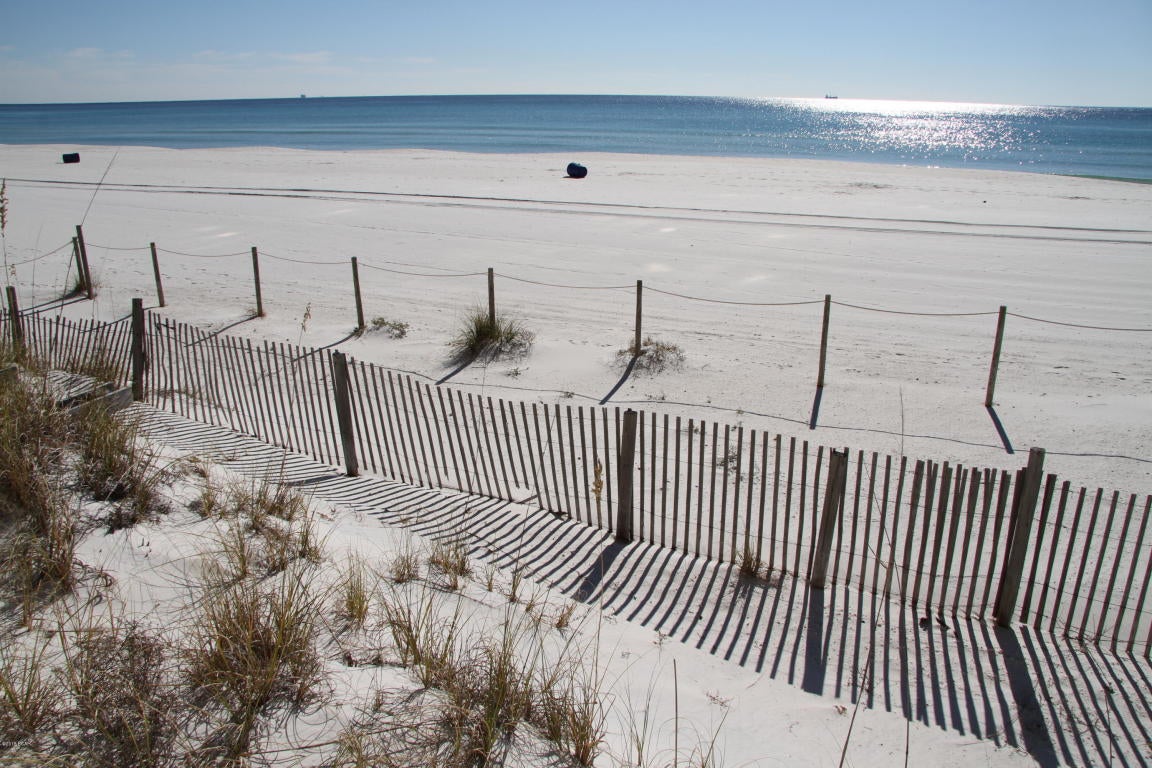 Have you always wanted to rent a nice quiet condo on the beach LONG-TERM?  HERE IT IS!!! Partially furnished unit is GULF FRONT.  Cozy but great views.  Perfect for long-term rental - Pelican Walk is a quiet condo resort on the east end of the beach - close to restaurants, Navy base, St Andrews St Park.  This one bedroom unit is partially furnished, has two full baths, and a balcony overlooking the Gulf of Mexico.