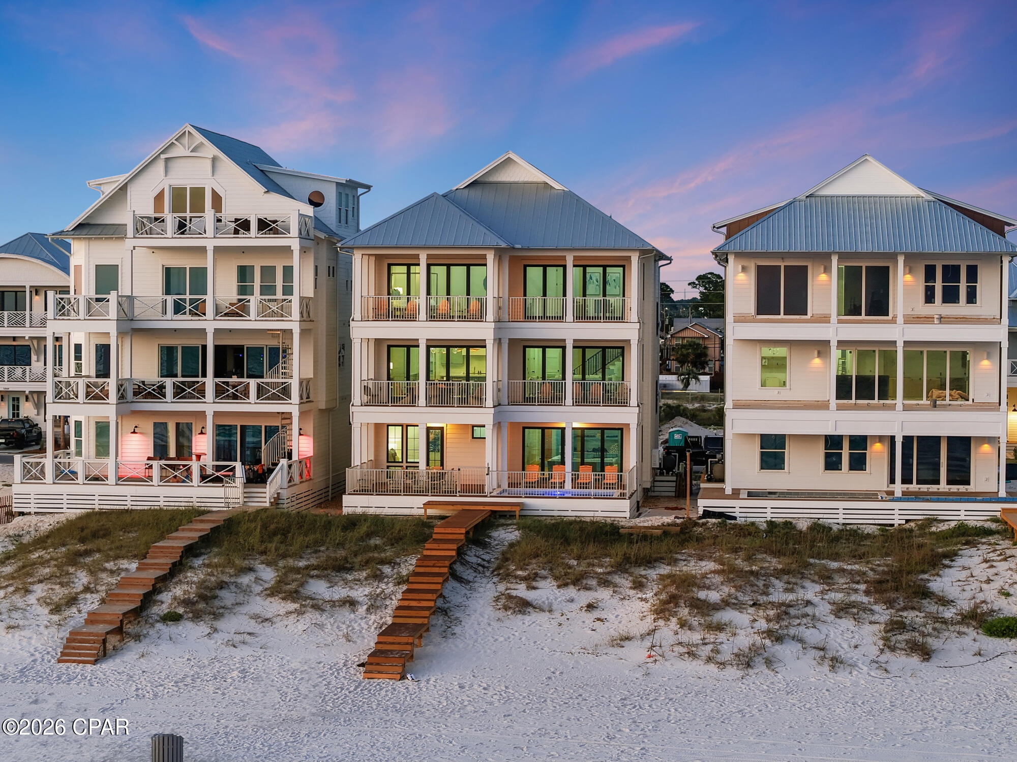 Set along the sugar-white shoreline of Panama City Beach, The Headliner at Hadley's Beach presents a rare opportunity to own one of the limited Gulf-front residences within Hadley's Beach, an intimate enclave of just 20 homes. With only 10 true Gulf-front residences in the community, this newly constructed offering represents one of the final opportunities to secure direct waterfront ownership in a setting designed for both elevated coastal living and exceptional investment potential, with short-term rentals permitted.

Positioned moments from the energy of Panama City Beach's celebrated dining, live music, and entertainment scene, the home offers the rare balance of privacy and connection. Owners and guests can enjoy evenings filled with waterfront concerts, local music venues, and vibrant coastal culture before retreating to the serenity of their own Gulf-front escape.

Spanning 5,662 square feet across three thoughtfully designed levels, the residence by Thor Construction & Design blends refined coastal architecture with modern luxury. Floor-to-ceiling windows frame uninterrupted Gulf views, drawing natural light throughout the interiors while showcasing the ever-changing blues of the water beyond. Just beyond the back door, private access leads directly to the white sand and turquoise shoreline, creating a seamless transition between home and beach.

The residence offers eight spacious bedrooms and eight bathrooms, carefully arranged to accommodate both large gatherings and quiet retreat. The second level serves as the heart of the home, where expansive living and dining spaces flow effortlessly into a chef's kitchen designed for entertaining against a backdrop of panoramic Gulf views. Clean architectural lines, elevated finishes, and generous proportions create an atmosphere that feels sophisticated yet inviting.

Occupying the upper level, the primary suite offers a private sanctuary overlooking the Gulf, complete with its own lounge area designed for peaceful mornings, sunset views, and evenings accompanied by the distant rhythm of the coast's live music scene.

Outdoor living is equally exceptional, with more than 1,300 square feet of porch space designed for open-air dining, relaxed conversation, and uninterrupted waterfront vistas. A private pool offers another space to unwind after a day on the beach, while the home's elevator and garage provide effortless convenience.

Offered fully furnished, The Headliner at Hadley's Beach is curated for immediate enjoyment. With direct Gulf frontage, refined construction, and proximity to the very best of Panama City Beach's coastal lifestyle, 5935 Gulf Drive is a statement residence where luxury, leisure, and the soundtrack of the Gulf Coast come together beautifully.