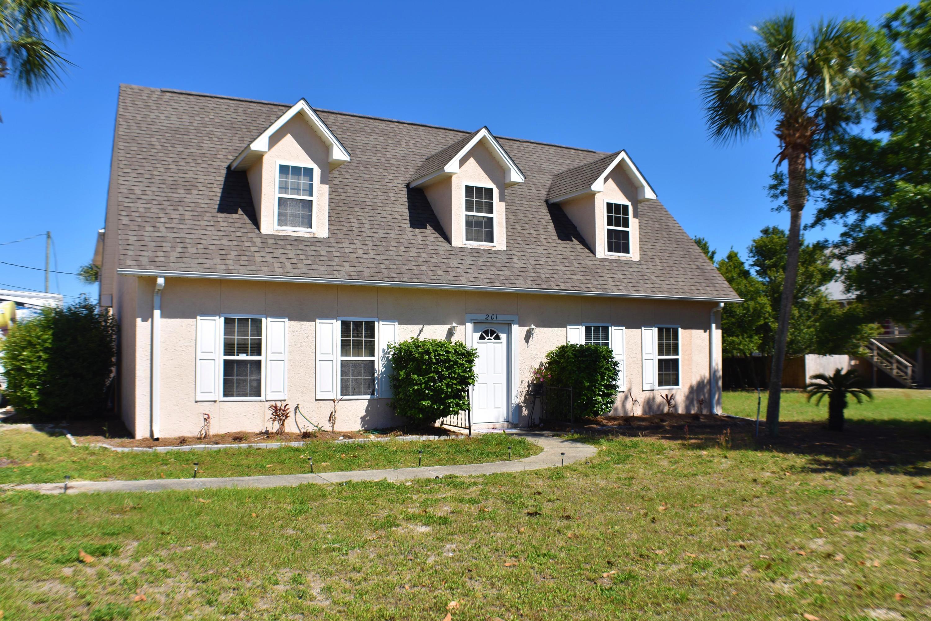 Are you looking for that rare beach home for a large or growing family? A spacious three bedroom, two and a half bath home, perfect for the beach loving family. The kitchen and dining area were designed to host large family gatherings. Don't forget to look at the oversized two car garage with 1 BR apartment above, with full bath, living & dining room and complete kitchen. This would be ideal for visitors. The apartment's adjoining deck is perfect for late morning sun bathing. Whether a year round home or a vacation compound, this home is walking distance to the World's Most Beautiful Beaches & just a 5 minutes drive to Pier Park!  All info is approx and must be verified by Bu