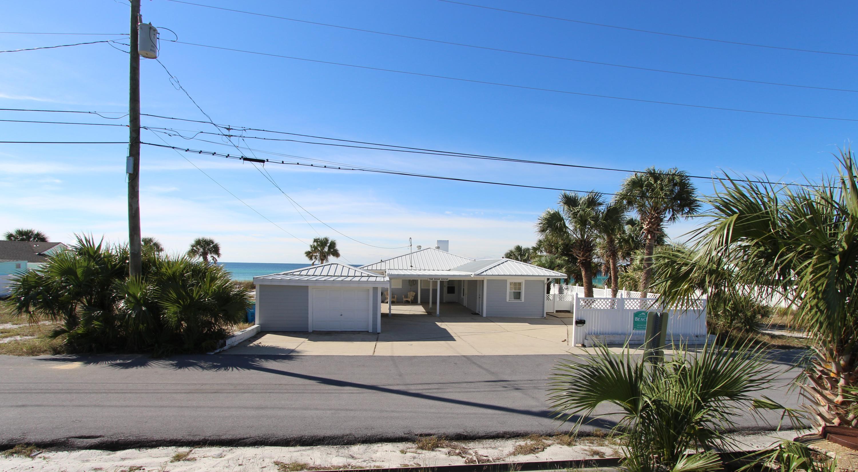 Unique Gulf Front Opportunity...There are a total of 3 60' x120' adjacent lots that can be purchased all together creating a total of 180' of Gulf Front property. Two different sellers involved. The lot at the east end of the 3 is listed on the Mls separately. This property has that Old School Beach House feel but with updated appointments throughout. The pictures really tell the story. It is an amazing luxury 1 story 5bd/4ba newly renovated home. (EVERYTHING BRAND NEW April 2019). Wide open beach (empty lots on both sides). Completely remodeled with shiplap, stainless steel appliances, fully equipped kitchen and all new furnishings throughout the home. It is a beach lovers paradise. The home boasts a large open floor plan. There are 2 masters one with a King bed and the other with a Queen bed and private baths & walk in showers. The Queen bedroom has a Queen bed and is located Gulf side, with windows so you have your own personal view. The kids will love the bunk room with 4 comfortable twin beds located Gulf side with Gulf views also. The last bedroom is detached from the home aka "The boyfriend room" it has a Queen bed with its own lavish walk in shower. The other bath is in the hallway and also has a walk-in shower as well. Large back deck for family gatherings, grilling or just taking in the sun and beautiful sunsets! Each room has a flat screen tv and a large flat screen tv in the living room as well. Dining room is located Ocean side with windows all along so you can enjoy the view while dining. Plenty of parking, large covered area road side to sit and enjoy the shade or park cars. This home is located in the middle of Panama City Beach, 2.9 miles from Pier Park. There are no large condos in this area so the beach is not as crowded as some other parts of PCB. You are within walking distance of amazing pizza and a local bars and restaurants as well.