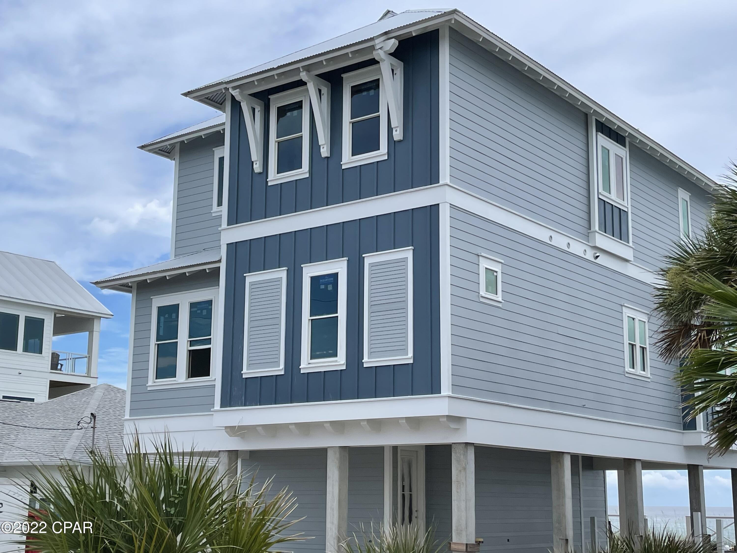 , Brand New Almost finished, Gulf Front Beach House, projected finished date 9/30/2022.  FULLY FURNISHED, PROFESSIONALL DECORATED. This Beach House is within walking distance to Pier Park and just across the street from Very Popular Dusty Raw Bar, (look for Blue House) The house will be fully Furnished, sleeps 20 and ready to go. This three-story home is built on a 50' x 124' with your own private walk over, pool and plenty of deck room on each floor. The house features two master suites that are gulf side.
