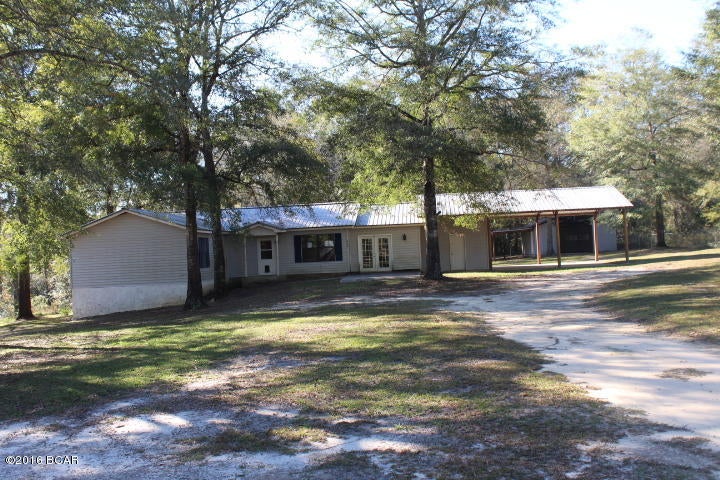 PRICE REDUCTION!! Large country home on 3.61 Acres with a pond, dock and even a small island! The property is mostly fenced with nice chain link fencing. There is a barn and a chain link fenced dog pen. The home has a large master bedroom with large master bath that does need to be completed. There is a living room, a den and large kitchen/dining room. It has a large utility room that could be utilized as a hobby room, etc. The area is near a popular fishing lake and there is wildlife in the area for the outdoorsman/woman. Call agent for more details.