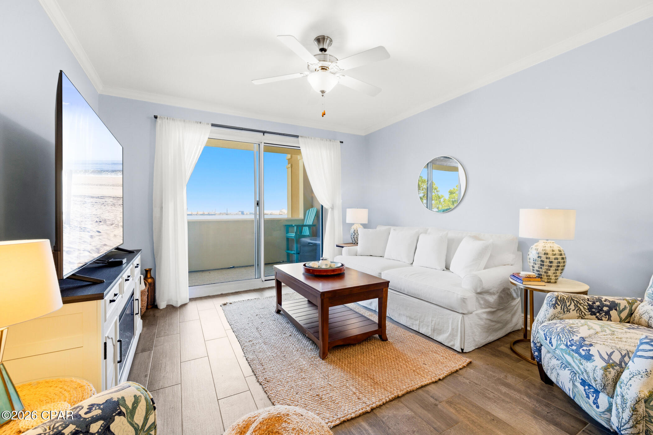 Wake up to breathtaking sunrises over St. Andrews Bay and unwind each evening with spectacular sunsets from your private balcony in this beautifully maintained 4th-floor residence at Magnolia Bay Club. This spacious waterfront condominium offers 3 bedrooms, 3 full baths, abundant storage, and panoramic bay views from the main living areas and primary suite. The kitchen features stainless steel appliances, granite countertops, solid wood cabinetry, a breakfast bar, and tile flooring. Fresh interior paint, updated furnishings, and coastal décor create a light, inviting atmosphere that's move-in ready. The primary suite is a peaceful waterfront retreat, while the second bedroom offers a private en suite, providing comfort and privacy for family and guests. Magnolia Bay Club amenities include a bayfront pool, clubhouse with kitchen, fitness center, billiards room, fishing dock, additional storage on the fourth floor, one assigned covered parking space, and ample guest parking. If you've been searching for waterfront living with incredible views, outstanding amenities, and a convenient location, this is one you won't want to miss!