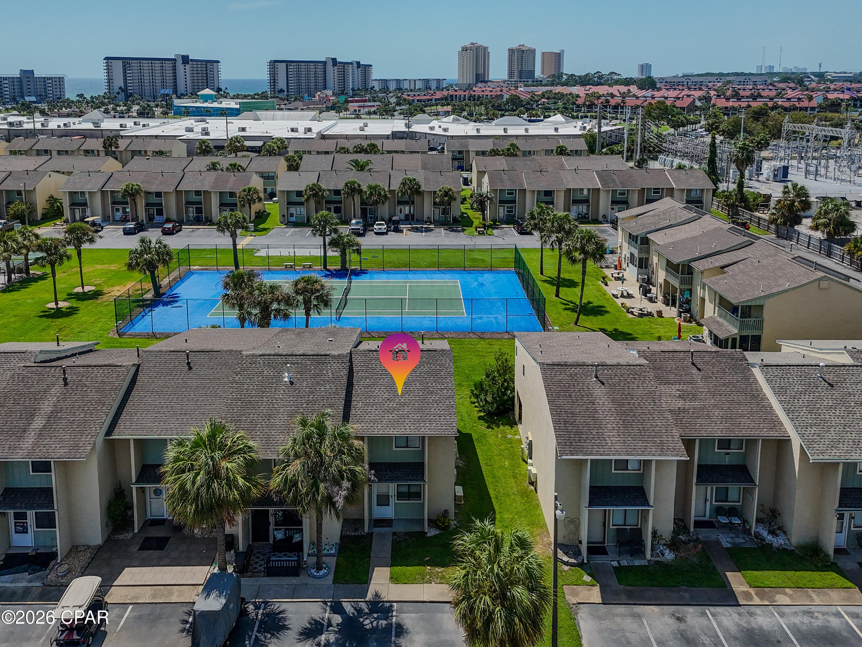 Welcome to your slice of coastal paradise in the highly desirable, gated Gulf Highlands Beach Resort! Perfectly suited as a high-yield short-term rental, relaxing second home, or turnkey primary residence, this freshly updated 2-bedroom townhome is completely move-in ready--just in time to capture peak rental season income.

Inside, you'll find a bright and airy layout featuring fresh interior paint in soothing neutral tones, brand-new modern lighting, soft neutral carpet, and low-maintenance tile flooring. The main floor offers a seamless flow between the dining space, living area, and kitchen counter island, while upstairs hosts private, peaceful retreats--including a spacious primary suite complete with a custom decorative headboard, full-length mirror, en-suite vanity access, and private balcony entry.

Outdoor living is where this property truly shines! Step out your back door onto your private covered patio to find a heated pool, tennis court, and shuffleboard courts waiting just steps away. Enjoy your morning coffee or evening breeze from either the ground-floor patio or the upper-level balcony, both overlooking landscaped green grounds. Additionally, the unit includes an exterior laundry closet and a spacious dedicated storage room for all your beach gear and tools.

Living in Gulf Highlands Beach Resort means enjoying unparalleled, world-class amenities right at your fingertips. Owners and guests have access to 11 swimming pools (including a beachfront pool), an exclusive Beachfront Clubhouse with a snack bar, 4 tennis courts, pickleball courts, and an 18-hole mini-golf course, all within a secure, gated community. Whether you are lounging by the pool or taking a short stroll to the sand, this resort-style townhome offers the ultimate Florida lifestyle.

Please note that age, square footage, and room dimensions are approximate, and the buyer should verify if important.