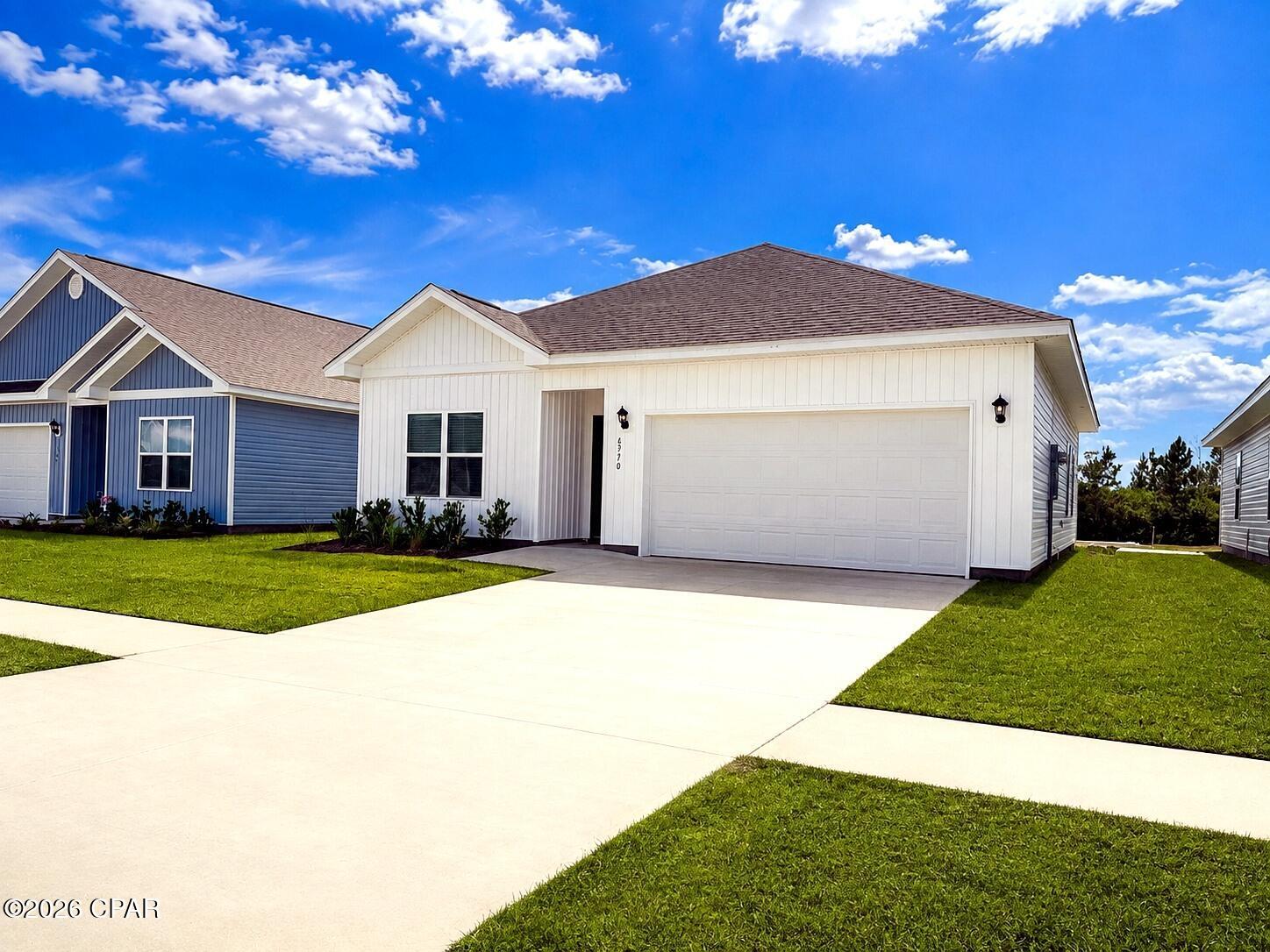 Discover modern comfort in this beautiful 2025-built home located in Panama City's Liberty community. This bright and inviting 3-bedroom, 2-bath residence offers approximately 1,293 square feet, a peaceful backyard pond view, a two-car garage, and access to an impressive collection of community amenities.

The open-concept living area features LVP flooring, recessed lighting, and an easy flow between the kitchen, dining area, and family room. The modern kitchen includes white cabinetry, granite countertops, stainless-steel appliances, a spacious pantry, and a large island with breakfast-bar seating.

The primary bedroom offers a private bathroom with a long granite-topped vanity and tub-and-shower combination. Two additional bedrooms provide comfortable space for sleeping, working from home, or hobbies.

Additional features include carpeted bedrooms, a dedicated laundry room, smart-home technology, double-pane windows, central heating and air, and an attached two-car garage.

Outside, enjoy the relaxing pond view from the backyard and covered patio. Liberty residents also have access to a community pool, clubhouse, fitness center, basketball court, playground, park, game room, business center, picnic areas, barbecue facilities, and gazebos.

With modern finishes, garage parking, a peaceful water view, and excellent community amenities, this home offers an appealing combination of comfort and convenience.

Schedule your showing today and see everything this Panama City home has to offer!