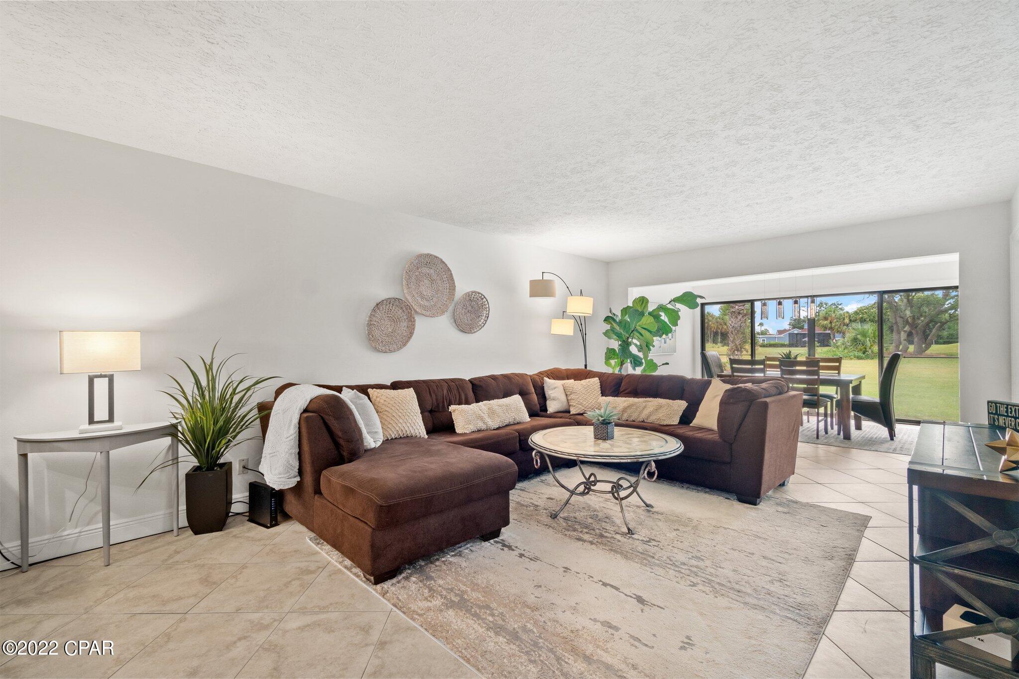 GROUND FLOOR, END UNIT 2BR/2B Golf Villa now available in the highly desired Bay Point Community! This unit looks over the 17th hole of the Nicklaus Golf Course where you can enjoy golf course views from nearly every room. Enjoy the open concept living/dining area. Let the light in with the floor to ceiling windows in both the master bedroom and dining/living area. Paver patios in both the front and rear. Bay Point community has lots of exciting things in the works, beautification projects, new marina, new developments with commercial opportunities and more!