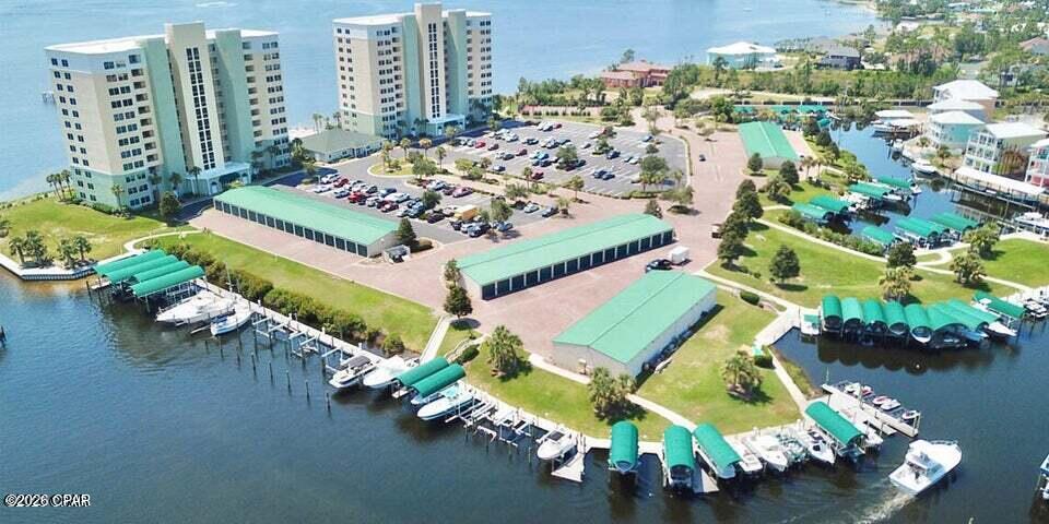 CURRENTLY UNDER CONTRACT, SELLER WILL CONSIDER BACKUP OFFERS' *HIBISCUS BY THE BAY* One of the most beautiful and unique waterfront gated community in Panama City Beach. Luxury living with amazing views overlooking St. Andrews Bay.  Spacious 2 Bedroom/2 full Bathroom, fully equipped kitchen with breakfast bar, large living room overlooking the bay, master bedroom is waterfront with sliding door access to the spacious balcony, master bath features tub, separate shower, double sink and a large walk-in closet.  Updated: AC, Water heater, appliances and hurricane resistant sliding glass doors,
Amenities include Tennis Courts/Pickleball, 500-foot-long fishing pier, community room, grills, picknick area and swimming pools. Location is convenient to Beautiful Panama City Beaches, restaurants and shopping.   Boatslips and garage spaces frequently come up for sale and rent. All dimensions are approx,