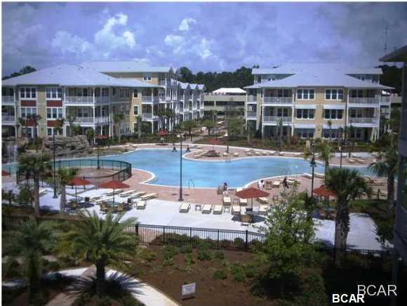Ground Floor... HUGE Patio!! YOU WILL FEEL LIKE YOU ARE LIVING IN A RESORT..ONE of the Best 2's IN COMPLEX & Ground Fllor Large Patio ... PERHAPS LARGEST POOL IN BAY COUNTY (1 acre) w/ two waterfalls, SPLASH PAD and spa plus numerous seating arrangements for your poolside entertaining... all on one level AND ELEVATORS AVAILABLE IN THE BUILDING This 2 bed 2 and a half bath unit is by far the best priced in Island Reserve. This unit has 2 Master Suites and each bedroom has a door to the large ground floor private patio overlooking the back close to the 1 acre pool There are floor to 10ft ceiling windows in the living room. Bamboo Floors and Granite Countertops throughout along with Stainless appliances make this hard to resist. The complex boasts an indoor H/C Basketball court along with