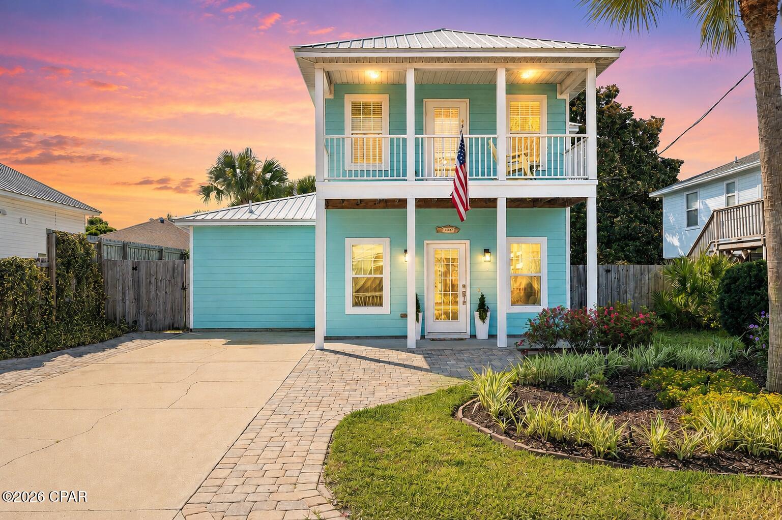 CURRENTLY UNDER CONTRACT, SELLER WILL CONSIDER BACKUP OFFER. Coastal charm, thoughtful upgrades, and a rare private beach lifestyle come together in this beautifully maintained Key West-style home in the highly sought-after Bid-A-Wee Beach community. With exclusive gated beach access and just two blocks from the Gulf, this 2014 residence captures the ease, durability, and quiet luxury of true coastal living.

Inside, the home offers a desirable first-floor primary suite featuring a double vanity and direct back patio access to the backyard. The kitchen balances style and function with high-end stainless steel appliances, induction stove, quartz countertops, a large center island, and built-in pantry shelving that adds both charm and practical storage. Also on the main level, the bright, open layout and bonus half bath make entertaining effortless. Upstairs, you'll find hardwood flooring throughout, along with two additional bedrooms, each offering an en suite bathroom and walk-in closet.

Outdoors, the lifestyle truly takes center stage. Lush tropical landscaping surrounds a private backyard retreat, complete with an outdoor shower that's perfect for rinsing off after a day at the beach before stepping back into comfort. The extended patio and fully fenced yard create the perfect post-beach sanctuary for grilling with friends, unwinding in the hot tub, or enjoying warm coastal evenings under the stars. Topped with a low-maintenance metal roof, this home also comes with no HOA dues and no required flood insurance. A spacious outdoor storage shed keeps beach gear, gardening tools, and seasonal items neatly tucked away. And don't forget to enjoy a glimpse of the Gulf every time you head out to check the mail.

From this exceptional location, you're perfectly positioned to enjoy everything Panama City Beach has to offer. Just minutes away are the newly opened TopGolf, Pirates Voyage Dinner & Show, World Famous Tootsie's Orchid Lounge, and 810 Billiards & Bowling. You'll also be approximately 2 miles from Pier Park, 8 miles from St. Andrews State Park, 12 miles from 30A, and 15 miles from Northwest Florida Beaches International Airport.

Homes in Bid-A-Wee that offer modern construction, thoughtful updates, a straight shot to the Gulf, and easy access to the best of Panama City Beach are a rare find. Schedule your private showing today and discover your own beachside escape.