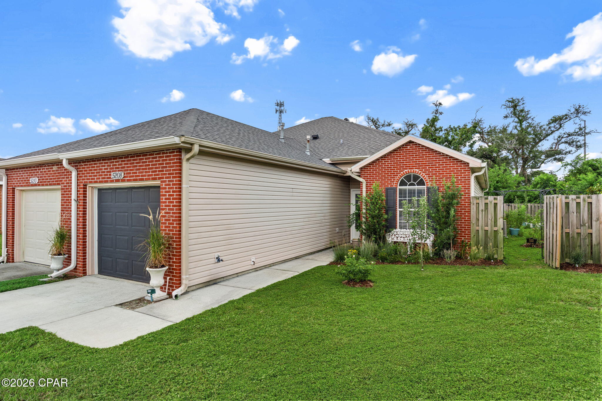Located at the quiet end of a cul-de-sac in the Panama City area, 5208 Joshua Ln is a thoughtfully updated duplex ready for its next owner. This 3-bedroom, 2-bathroom home offers 1,401 square feet of living space that balances modern updates with practical, everyday comfort.

Inside, LPV flooring runs throughout the main living area, while soft carpet brings warmth to each bedroom. A fireplace anchors the living space, making it a cozy spot on cooler evenings. A slider opens to a generous backyard, complete with a pretty rose garden--ideal for gardening, relaxing, or hosting weekend gatherings.

The kitchen comes equipped with stainless steel appliances, a breakfast bar, and a roomy pantry that keeps essentials organized and accessible. Both bathrooms have been updated with new vanities and refreshed lighting for a clean, contemporary look. The master bedroom serves as a private retreat, featuring a large walk-in closet and a comfortable ensuite bath.

The location adds further value. Springfield Sports Complex is less than a mile away, perfect for active afternoons, and grocery options are just minutes from home for quick errands.

Whether you're seeking a move-in-ready home or a solid investment, this property delivers comfort, convenience, and value in one neat package. Homes in this established neighborhood move quickly--schedule your private tour today.