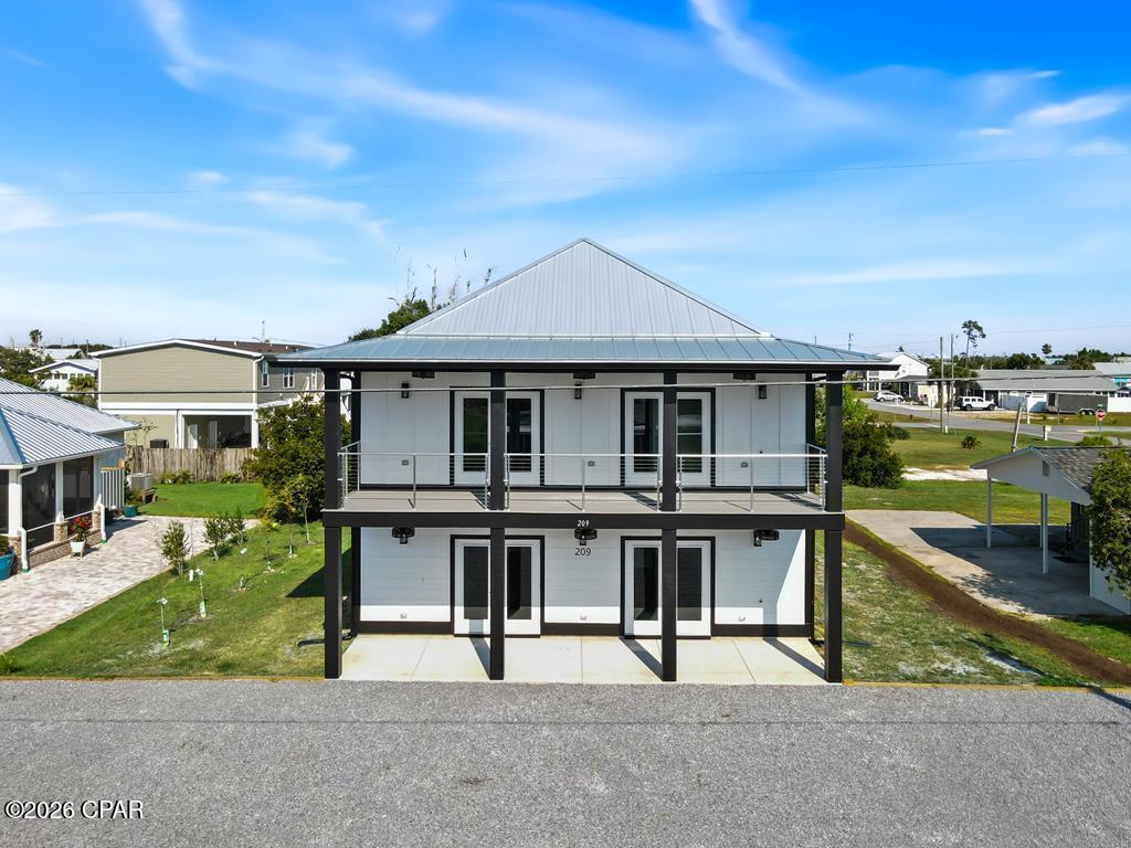 BEAUTIFUL NEW HOUSE LOCATED IN THE HEART OF MEXICO BEACH, JUST RECEIVED OUR CO ON 09/17/2025. THE OUTSIDE SIDING ON FIRST FLOOR IS NICKLE GAP, AND TOP FLOOR HAS HARDI BOARD AND BATTEN. ALL WINDOWS AND DOORS ARE IMPACT RATED. SPRAY FOAM INSULATION WHOLE HOUSE, HIGH EFFICIENCY HVAC, CERAMIC TILE IN ALL BATHROOMS WITH CUSTOM SHOWERS IN MASTER AND HALL BATH. SOAKING TUB IN THE MASTER. LARGE WALK IN CLOSET IN MASTER BEDROOM. CUSTOM HANDRAILS ON UPSTAIRS DECK. LARGE ISLAND IN KITCHEN WITH 3CM QUARTZITE COUNTERTOPS. NEW APPLIANCES, WASHER AND DRYER, CYPRESS WRAPPED BEAM IN LIVING ROOM. LVP FLOORING IN ALL AREAS EXCEPT BATHROOMS. ALL BEDROOMS ARE VERY SPACIOUS. THIS CUSTOM HOME IS WAITING FOR ITS FOREVER HOME OWNERS.