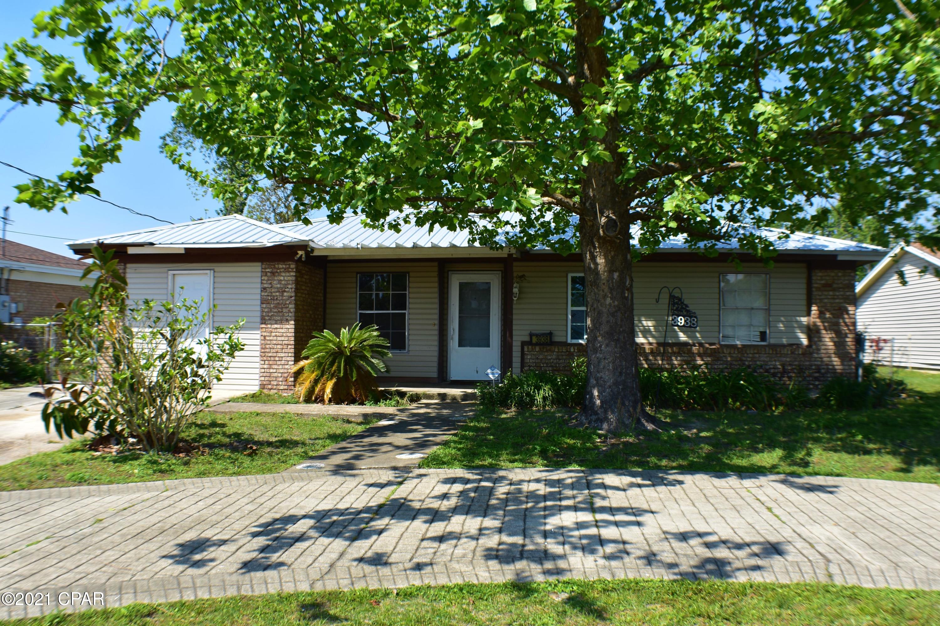 This  would make a great starter home or investment property!  This 3BR/2BA home is close to the colleges, shopping, medical facilities, parks, St. Andrews and more!  The home needs some TLC and updating, but this home has a five year old metal roof, a 2 year old water heater, lots of space inside including a bonus/Florida room, interior storage, a large open backyard with a storage building, and a circular driveway!   It's also all electric and on city sewer and water.  All info is approx and must be verified by Buyers if important.