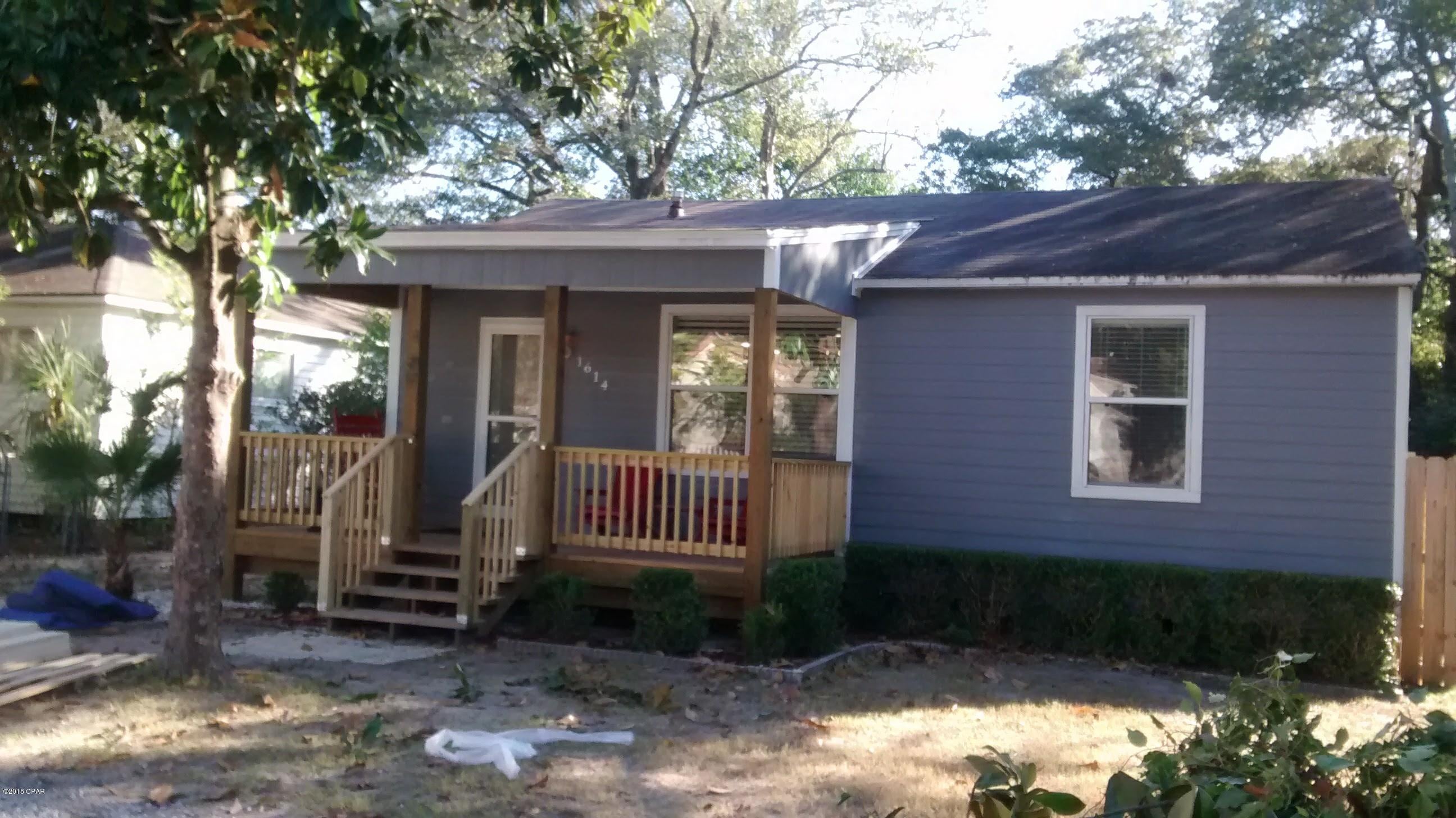 This adorable 2-Bedroom, 1-Bath  has been totally updated, including plumbing and electrical and is in St. Andrews a couple blocks to the bay.  This house suffered minor damage  in Hurricane Mathew and the owner has already scheduled repairs. There is an oversized kitchen/dining room with an adjoining bonus room that goes out to a large raised deck.  The front of the house is framed with a pretty covered porch.  All rooms in the house have attractive crown moldings ad the living area has recessed lights.  There is a detached single garage which has a workshop the same size as the garage area and an additional attached storage area that is 11 x 13, all under the same roof and all heated & cooled.  The oversized back yard is entirely fenced with a chain link fence.  Hardi Plank siding and vinyl soffit makes for maintenance free exterior.  Perfect for starter home, retired couple, or rental property.