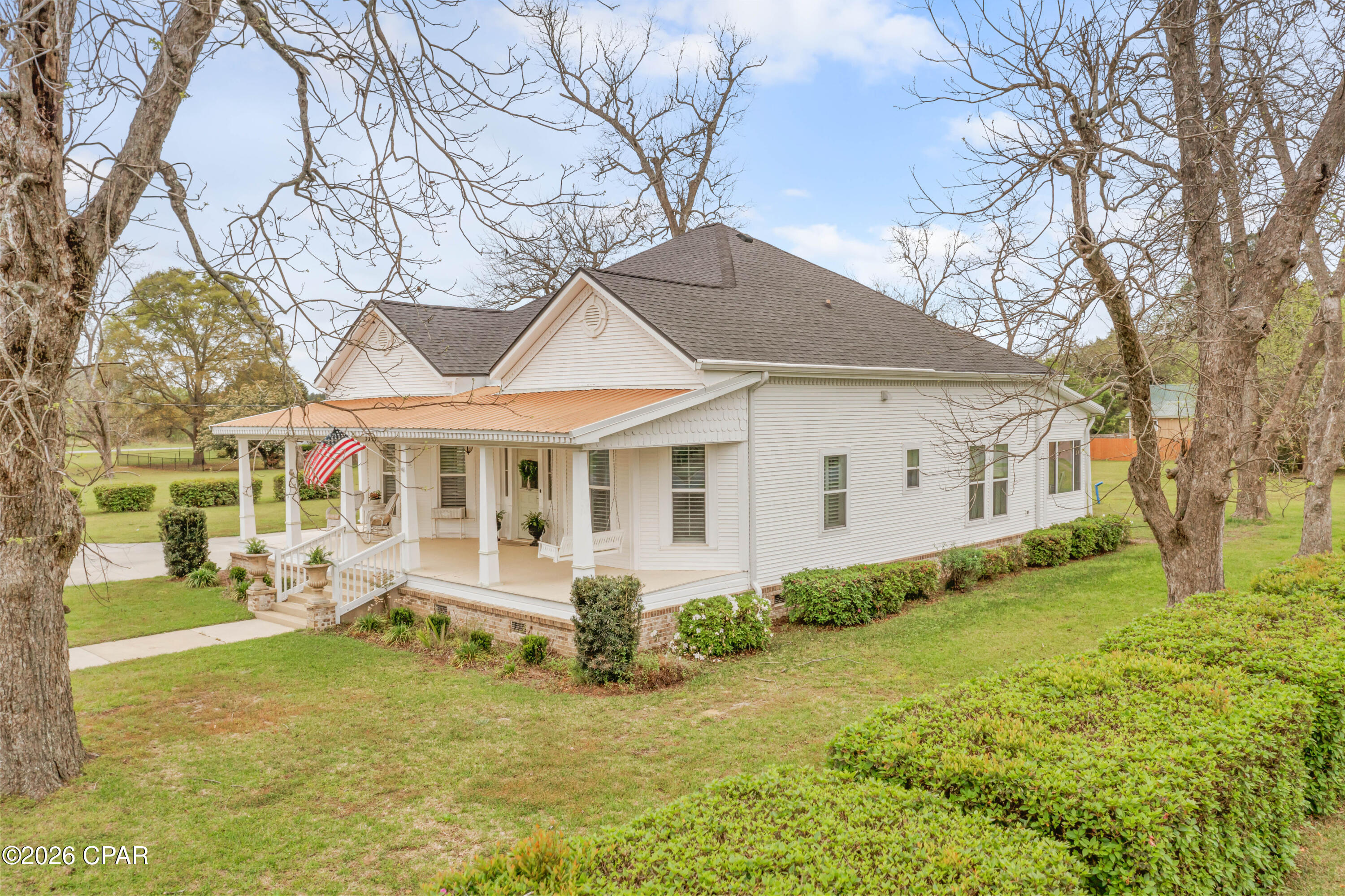 Step into timeless Southern charm with this stunning 3-bedroom, 2-bath historic home set on nearly half an acre of beautifully manicured grounds. Built in 1908 in the heart of a pecan grove, this remarkable property blends classic elegance with modern updates while preserving its original character.

From the moment you enter, you're welcomed by a grand foyer featuring LVT flooring (original heart-of-pine floors are underneath if you prefer them) and soaring ceilings, highlighted by a breathtaking antique gasolier glass chandelier. The home showcases exquisite details throughout, including crown molding, tall ceilings, and four fireplaces--two equipped with gas logs.

Thoughtfully updated for comfort and efficiency, recent improvements include a 2021 roof with lifetime Atlas shingles, new decking and underlayment, 30 inches of insulation, copper penny roofing on the carport and porches, energy-efficient double-hung vinyl windows with Plantation shutters / blinds. Rheem central heating and air, and a Generac whole-home generator.

The spacious kitchen is perfect for entertaining, featuring granite countertops, a large center island, and all-new stainless-steel appliances. Just beyond, enjoy a heated and cooled sunroom overlooking the private, fenced backyard--an ideal space for relaxing with a glass of lemonade

Located on a prominent corner lot along the main street in the charming town of Malone, this home offers small-town living at its finest--just a short walk to local shops, schools, the post office, and dining, and a quick drive to Marianna.

A rare opportunity to own a piece of history with modern comforts--this Southern gem is ready to welcome you home.