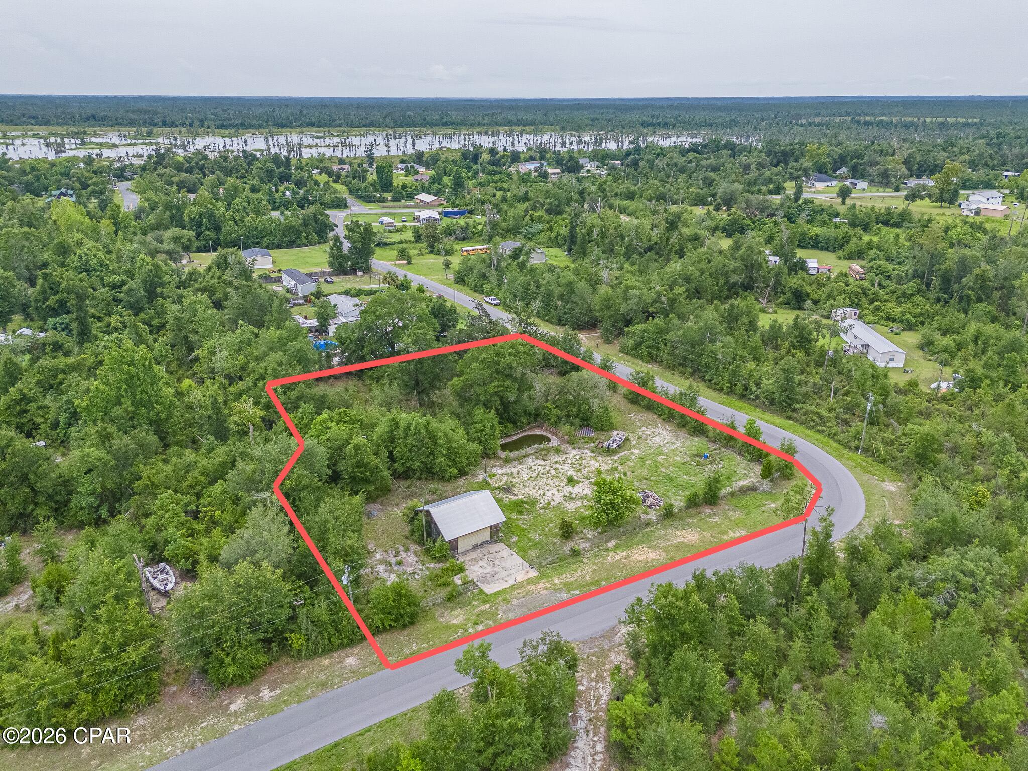 1.17-acre homesite in Youngstown with power available and has a well, septic and pole barn! There's plenty of room to build or place a new manufactured home. Previously improved property with established access and a convenient location just a short drive from Panama City, Tyndall AFB, and local shopping. Enjoy country living with space for a garden, workshop, RV, or recreational vehicles. No HOA. Bring your plans and make this property your own!