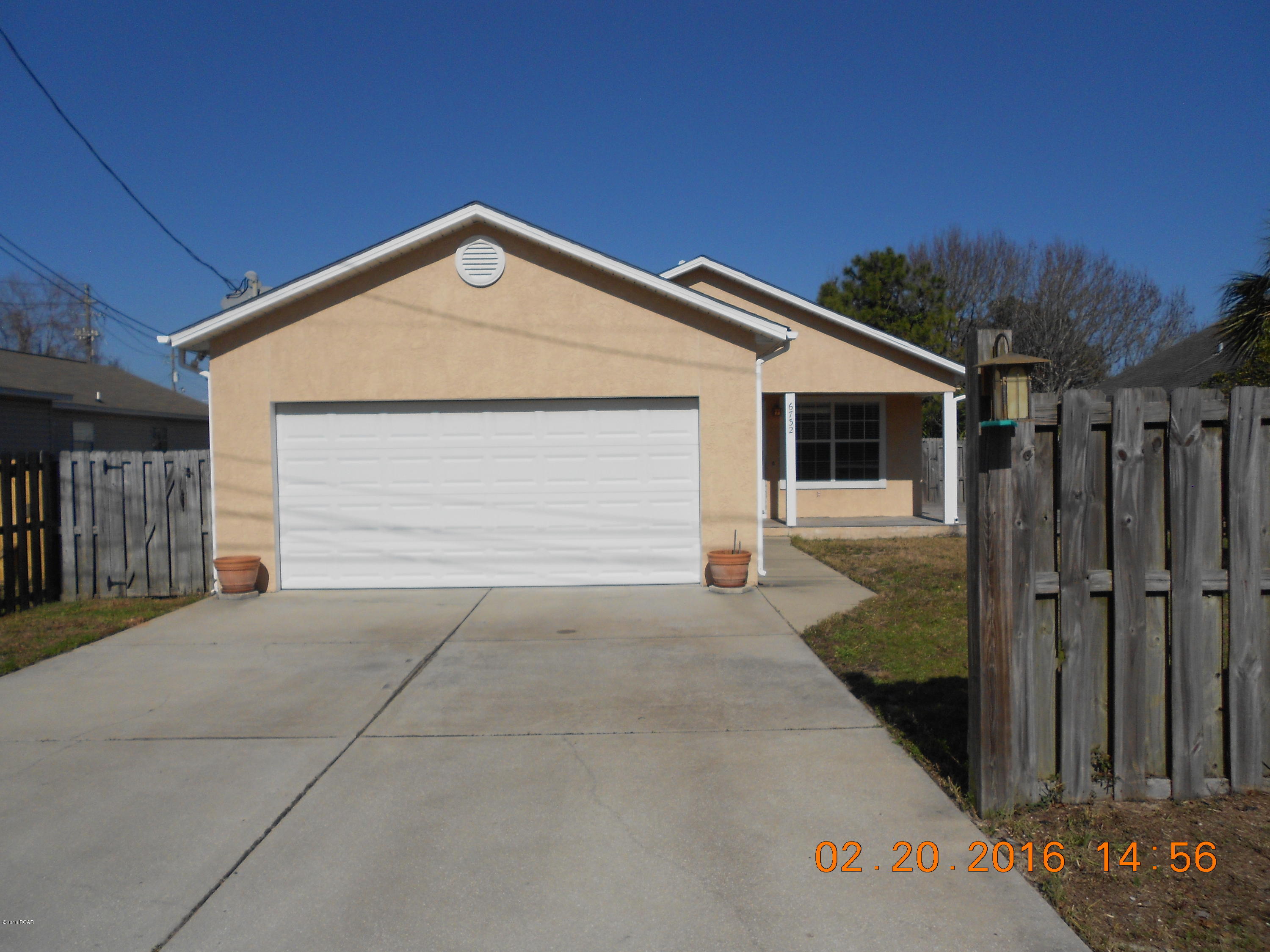Perfect location within a short walk to the beach with this 3 bedroom, 2 bath home just off Thomas Drive and close to the boat launch at Grand Lagoon. Porcelain tile in the kitchen and bathrooms. French doors in the living room lead out to a fenced yard and deck for your grilling and outdoor enjoyment. This home is move in ready. All dimensions are approximate. New water heater is currently being installed.
