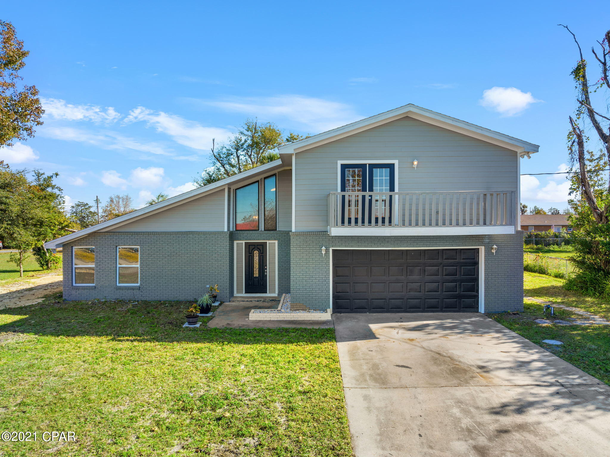 Welcome home! This newly renovated home is across the street from the Callaway Bayou, in Callaway Shores and is just a short drive to the Tyndall Air Force Base, shopping, restaurants, and downtown. This home sits on over a third of an acre with a two-car garage and extended driveway. Walking through the front door you will be greeted with vaulted ceilings and new flooring throughout in an open floor plan. In the kitchen there's natural light highlighting the new cabinets and countertops. Upstairs brings you to living quarters including the owner's suite featuring an en-suite bathroom and a private balcony. Downstairs, French doors lead you outside to a large screened-in porch overlooking the backyard and a private sauna room. We're expecting multiple offers so schedule a showing today!