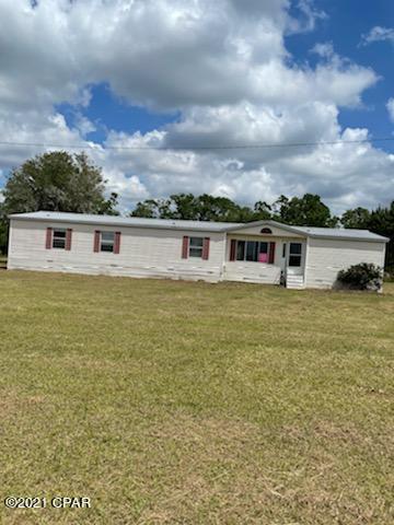 WOW..... Just look at this 4 Bedroom 3 bath DWMH with 2240 sq ft. Located in Campbellton Florida and sitting on 3 acres at a dead end street. Large kitchen with island and lots of cabinets. Separate living room and family room. Family room has a fireplace to keep you warm in the winter. Relax on the back covered deck and watch the kids play in the yard!! Plenty of room for you to add storage buildings for your toys or a pool for the kids! This home is priced to Sell so call today before you miss out on this wonderful opportunity!! Home to be sold AS-IS.