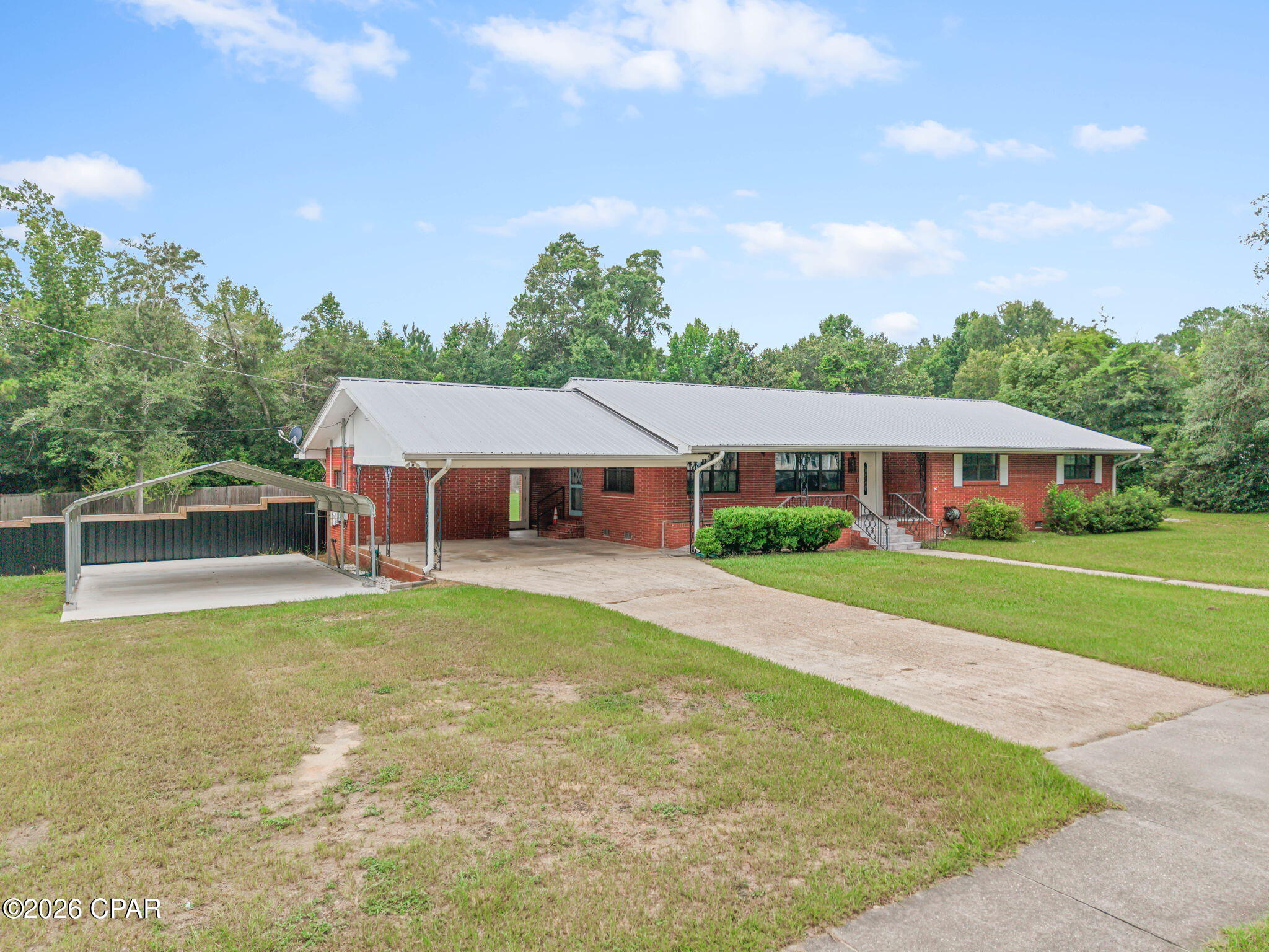 Discover the perfect combination of space, comfort, and versatility in this well designed 3 bedroom, 2 bath brick home situated on a generous 0.86+/- acre lot within the city limits. Offering over 2,100 square feet of living space, this home provides a functional layout with room for everyone both inside and out! The welcoming living room flows seamlessly into the dining area and spacious kitchen, creating an ideal setting for everyday living and entertaining. The kitchen features abundant cabinetry, generous counter space, stainless steel appliances and plenty of room to gather. Just off the kitchen, a versatile bonus room offers endless flexibility as a home office, playroom, fitness space, or additional den. All three bedrooms are conveniently located together down the hallway, including the spacious primary suite featuring a walk-in closet and private bath with a large walk-in shower. The two guest bedrooms are generously sized and share a well-appointed full bathroom. At the rear of the home, a heated and cooled Florida room provides additional year-round living space, making it the perfect spot to enjoy your morning coffee, entertain guests, or simply relax while overlooking the backyard. The outdoor space continues with a gazebo, fire pit area, and detached workshop, offering endless opportunities for entertaining, hobbies, storage, or weekend projects. The large backyard provides plenty of room for children, pets, gardening, or simply enjoying the open space. This property offers the convenience of town with the rare benefit of nearly an acre of land. With a functional layout, flexible bonus room, abundant outdoor living spaces, and a spacious yard, this home is ready to accommodate a variety of lifestyles.