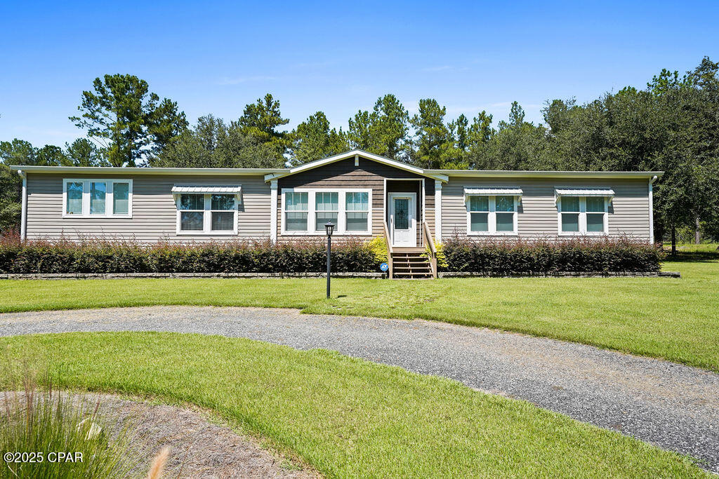 Welcome to The Huxton—a large 4-bedroom, 2-bath manufactured home perfectly situated on 4 acres in a peaceful setting. This property offers the ideal blend of comfort, space, and functionality.

Step inside to discover a bright and inviting open-concept layout, where the spacious living room flows seamlessly into the kitchen and dining area. The kitchen boasts ample cabinetry, a center island, and plenty of room for meal prep and gatherings.

The split-bedroom design ensures privacy, with the primary suite featuring a double vanity, oversized walk-in closet, and a relaxing ensuite bathroom. Secondary bedrooms are generously sized, offering comfort for family or guests.

Outdoors, the 4-acre parcel provides endless possibilities—whether you envision gardening, hobbies, or simply enjoying the tranquility of wide-open space. This property also offers lots of outdoor opportunities nearby! Three Rivers State Park is less than one minute away, Howell's Landing on beautiful Lake Seminole is under two minutes away, and the Apalachee Wildlife Management Area is only three minutes away—perfect for those who love nature, fishing, and outdoor recreation.

Don't miss the opportunity to make this beautiful home yours!