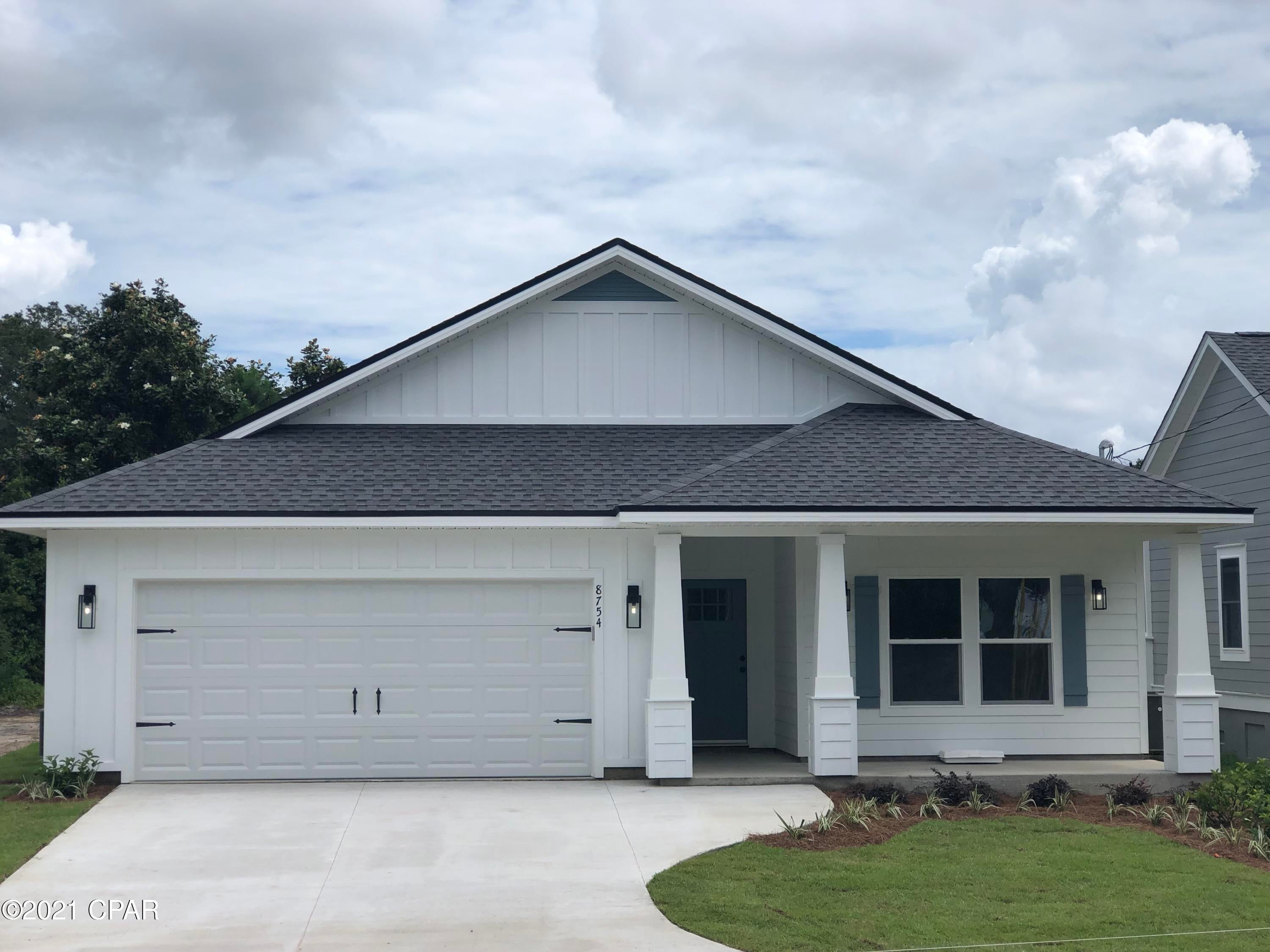 NEW CONSTRUCTION!! This 4 bedroom 2 bathroom house sits on one of the most pristine roads in Bay County with water views from your front porch and less than a mile from the beautiful Gulf of Mexico. The home features an open concept living space for smooth transition from room to room and to the outdoors. Enjoy the Granite countertops throughout, double vanities in the Master bath with an oversized custom floor-to-ceiling tile shower and large walk in closet. Equipped with beautiful Stainless steel appliances, 9ft kitchen island, luxury vinyl plank flooring, 9ft ceilings throughout with trey ceilings in the great room and master bedroom, 2-car garage, irrigation, and two covered porches to give you plenty of space. Sort term rentals are allowed in this area.
