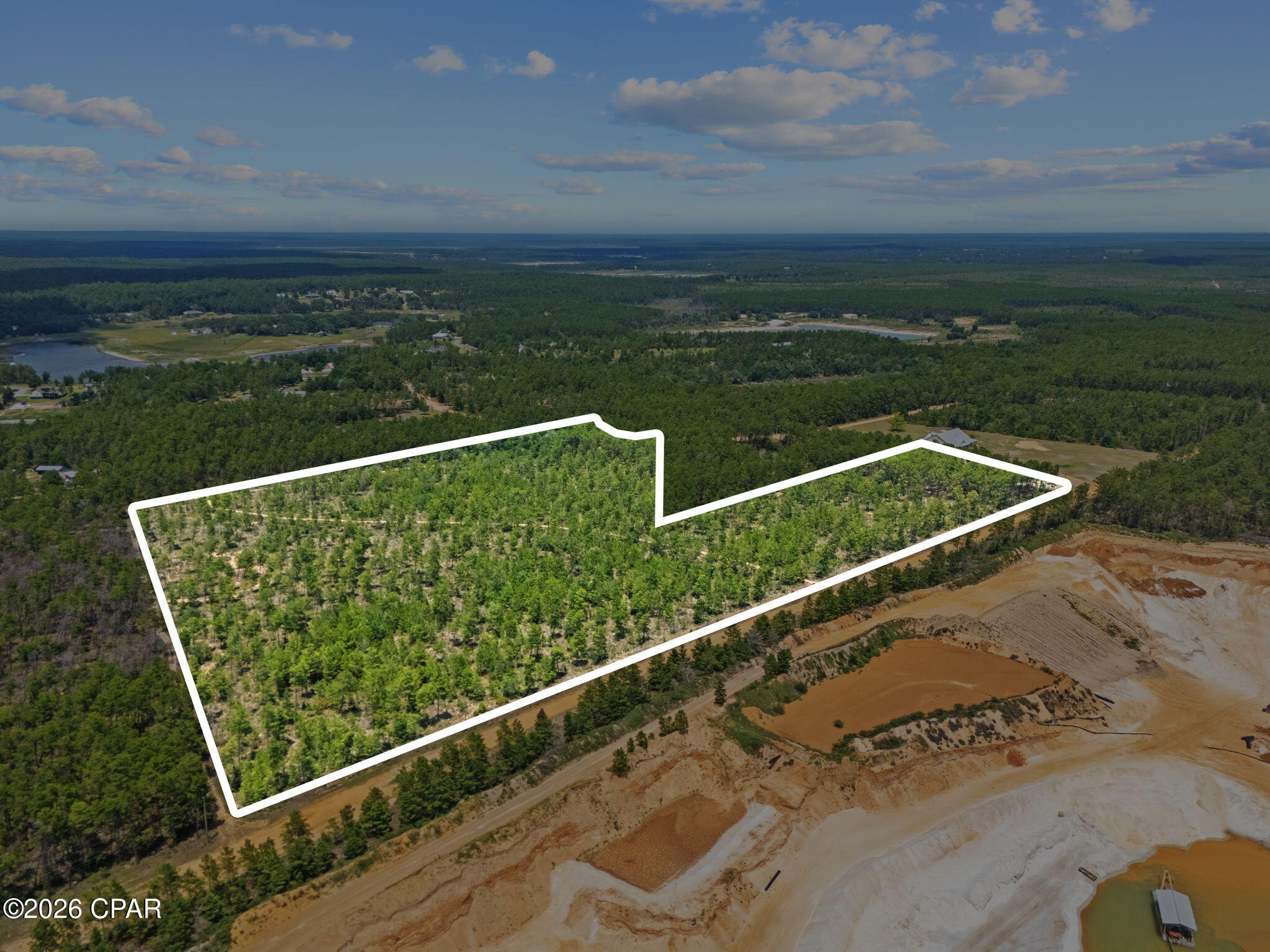 Discover 25.57± acres of space, privacy, and possibility tucked away off Lakin Drive. With access from both Lakin Drive and Casper Drive, this expansive property offers a rare opportunity to own a substantial piece of Northwest Florida and create something entirely your own.

Whether you envision a private homesite surrounded by nature, a sprawling country estate with room for a workshop and recreational space, or simply want acreage to hold for the future, this property offers the freedom that comes with having more room to work with.

The parcel is partially zoned Residential Single Family, with the majority carrying an AC Non-Ag land use designation. With more than 25 acres, there's room to create separation from neighboring properties, enjoy the outdoors, and design a property around the lifestyle you've been looking for.

Imagine a long private drive leading home, space for a detached shop or additional storage, trails through your own property, evenings around a fire, and plenty of room to enjoy the outdoors--all while remaining within driving distance of shopping, dining, schools, and everyday conveniences.

The two points of access from Lakin Drive and Casper Drive add another layer of flexibility to an already unique tract of land.

If you've been waiting for acreage where you can trade crowded neighborhoods for privacy, space, and the freedom to create your own version of home, this 25.57± acre property is ready for your vision.

Bring your plans, bring your builder, and come walk the property.
Buyer to verify zoning, land use, access, utilities, development potential, measurements, and all other information deemed important.