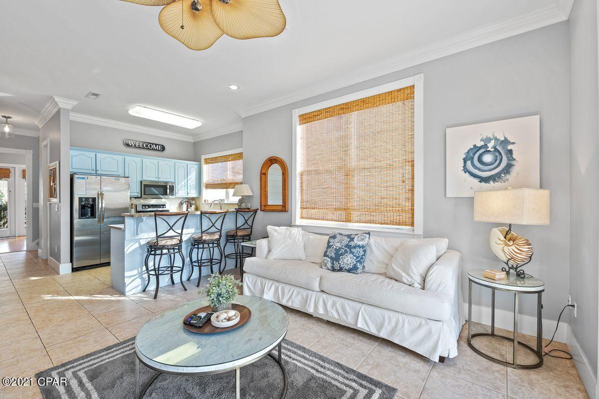 Located in the gated La Valencia Beach Resort community, this wonderful vacation retreat offers a spacious floor plan and deeded beach access. Well-maintained and move-in ready, interior living spaces are open and serene with high ceilings, a neutral color palette, and tile flooring. Natural light flows seamlessly through oversized windows. The fully-equipped kitchen features stainless steel appliances, granite countertops, and a breakfast bar, while a separate dining area includes a shiplap accent wall. The back door leads to a spacious covered deck for outdoor dining and entertaining. This three-bedroom townhome offers comfortable accommodations with one suite located on the first floor and a master suite and additional guest room upstairs. A second-floor bunk area provides additional sleeping space. A private deck off the master suite provides a perfect place to enjoy mild-weather mornings or evenings with a favorite beverage or good book in hand.

Offering a West End Panama City Beach location and just four miles from Scenic Highway 30A, La Valencia Beach Resort owners also enjoy desirable community amenities, including tennis courts, onsite security, and two pools, one of which overlooks the Gulf of Mexico. Best of all, sugar-white sands and emerald green waters are no more than a block away.