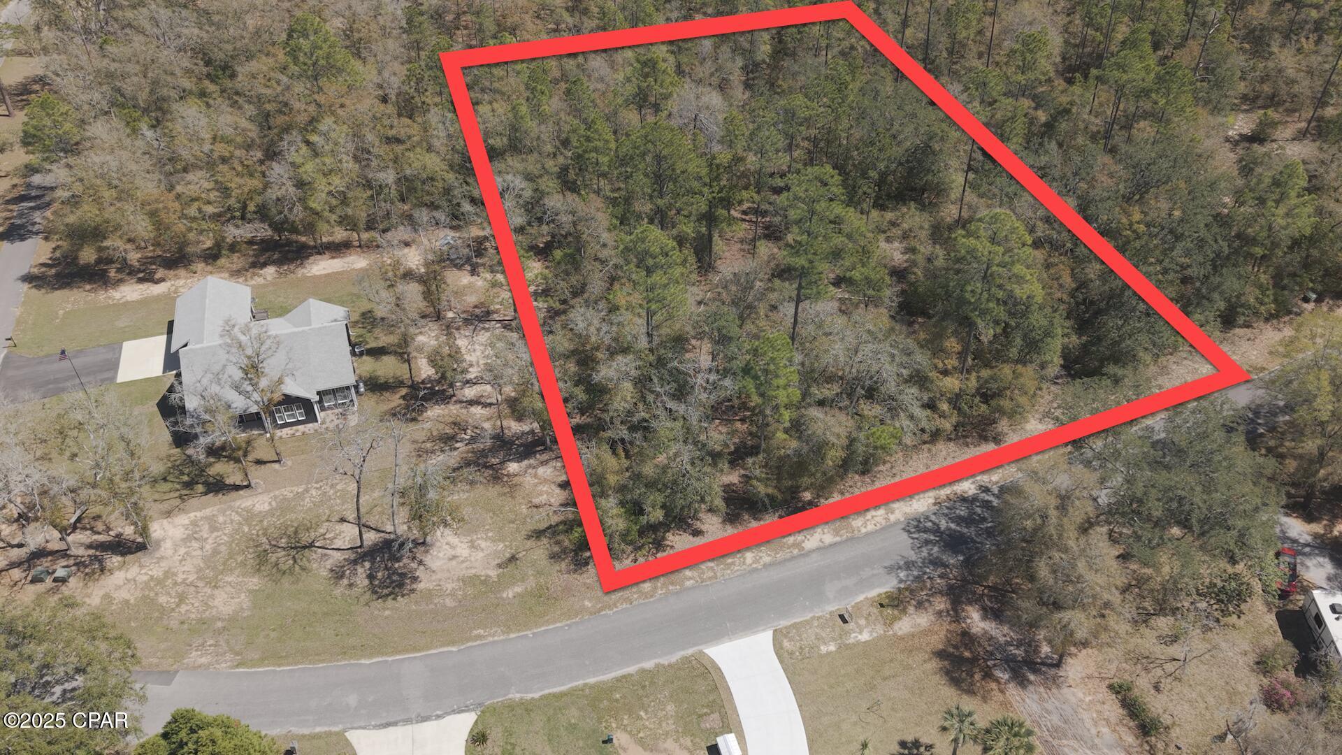 Over 1.5± Acres with a Waterview in Paradise Lakes! Sellers originally intended to build on the land, but have decided to purchase new instead - their loss, your gain. Overlooking Dunford Lake, this little slice of paradise is level with natural hardwoods, pines, and even a Holly tree. Paradise Lakes has underground utilities & beautiful sunsets to enjoy from your property. Utilize the community boat ramp to go fishing or make a short trip to the local produce stand just down Moss Hill Road. Only about 45 minutes from Panama City & PCB to enjoy the World's Most Beautiful Beaches.