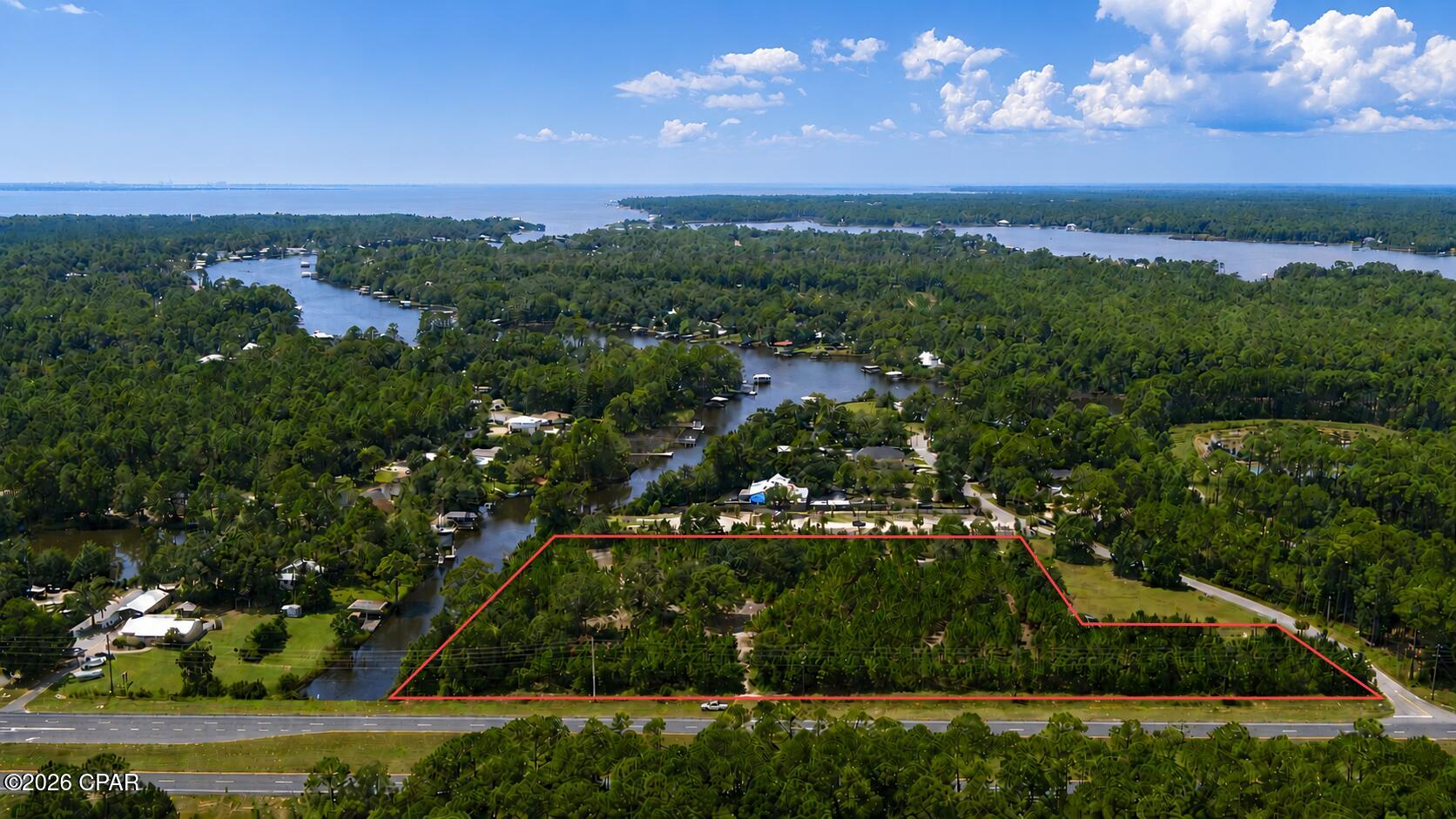 Positioned at the southwest corner of U.S. Highway 331 South and Sweetwater Lane, this 5.99± acre waterfront development site offers a rare combination of highway exposure, corner visibility and navigable water frontage. The property is located approximately one-half mile north of the U.S. 331 Bridge and just one-half mile south of the new Walmart development, placing it directly along the primary corridor connecting rapidly growing Freeport with South Walton. As development pressures and land values continue to push north from the high-cost South Walton corridor, this location offers an opportunity to capture the accessibility, customer base and growth associated with South Walton at a potentially more attractive development basis.

The assemblage features approximately 785 feet of frontage on U.S. 331 and 420 feet along Mallet Bayou, which borders the property to the south and provides navigable access through Choctawhatchee Bay to the Gulf of America. The waterfront creates an exceptional setting for hospitality, dining or boat-accessible restaurant uses, while the extensive highway frontage supports multiple retail, medical, financial and service-oriented development pads. Despite its waterfront setting, the vast majority of the property appears high and dry and is shown within Flood Zone X, allowing developers to capitalize on water views without sacrificing substantial usable upland area.