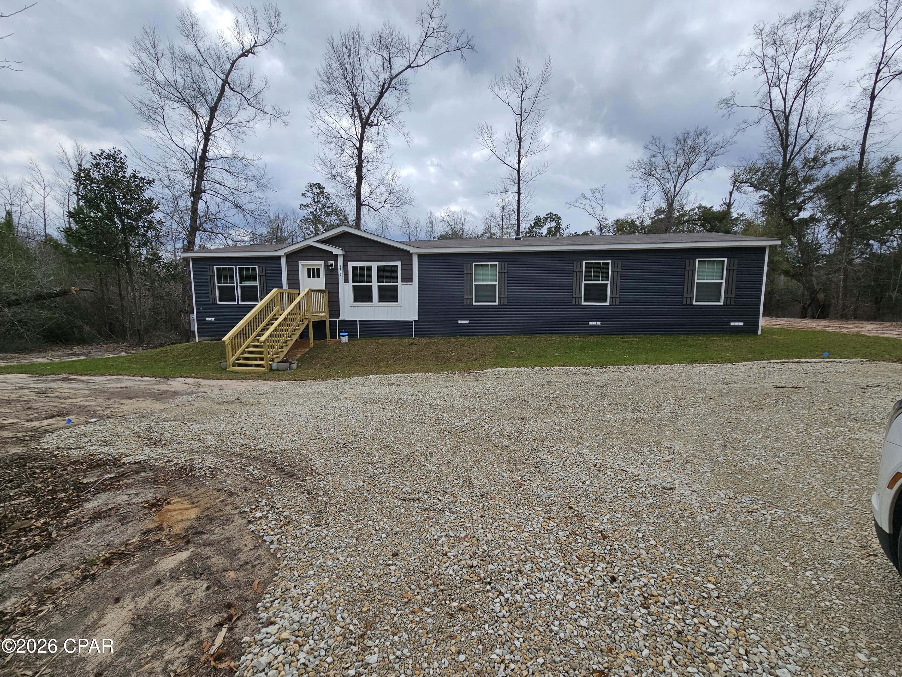 Brand new 2026 ''The Boujee XL''  this double-wide manufactured home offers a spacious 1980 square feet of living space designed for modern family living on one acre. With four bedrooms and three full baths, there's plenty of room for everyone to thrive. The home features durable 2x6 exterior wall construction for enhanced insulation and energy efficiency, plus finished sheetrock walls for a clean, contemporary look. A ceramic shower adds a touch of everyday luxury. Located in Compass Lake in the Hills, residents enjoy a tranquil setting just 30 minutes from Panama City, providing a great balance of peaceful community living and easy access to city amenities. This property is ideal for families seeking a fresh, move-in-ready home in a welcoming neighborhood. .  We have lenders that can help make your dream of home ownership a reality. 
All measurements to be verified by buyer