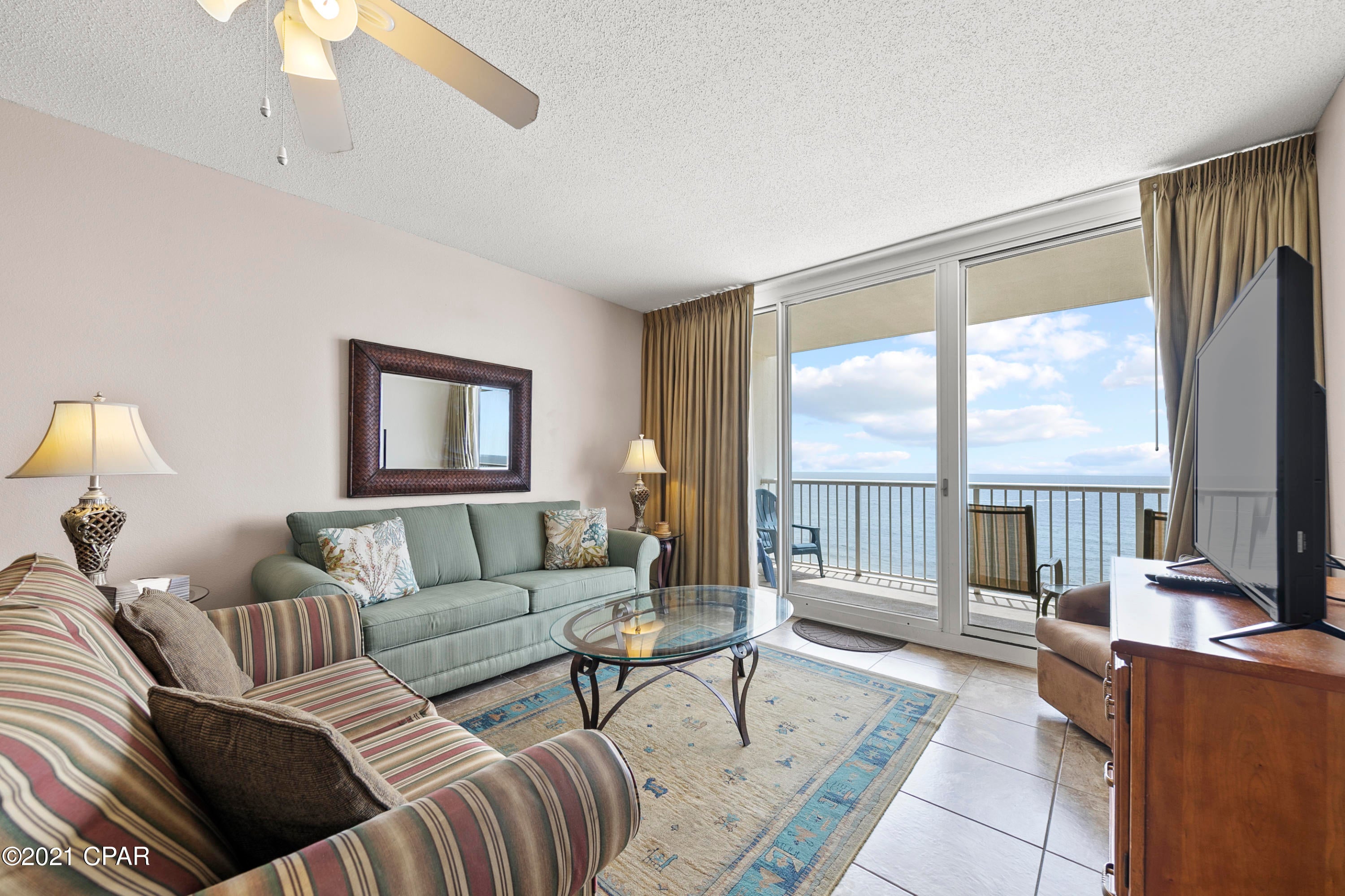 EXCELLENT LOW FLOOR ELEVATION! COMES WITH A WITH PRIVATE, DEEDED PARKING SPACE #369! Majestic 1-704 is the beach getaway that you have been dreaming of! Super-efficient floorplan, this 3 bedroom , 2 bath gulf front condo has a PRIME lower floor location in the deluxe 23-story Gulf front complex. Open floorplan and 9' ceilings allow for fabulous Gulf and sunset views from balcony, living room, dining room, kitchen, & master suite providing the ultimate alfresco living and entertaining environment! It lives like a beach house but comes with all the benefits of owning a condo. Great for second home, vacation rental or full time living! This clean, well maintained, turnkey offering will convey fully furnished, decorated, and rental ready. Ceramic tile in common areas makes for super low maintenance. Interior features include a spacious and open floor plan with raised ceilings. The gourmet kitchen is fully equipped. Sunset views from the generous, private, balcony are a perfect end to a sunny day and beginning to an exciting evening. MAIN MASTER SUITE is front and center on the beach with direct access to the main balcony and private bath complete with garden tub, separate shower, and large walk-in closet. The master suite opens from a glass slider door to a covered balcony. LUXURY! COMFORT! CONVENIENCE! There is plenty of storage throughout this unit with the ample closets and oversized laundry area complete with full sized washer and dryer. Can be configured to sleep up to 10 people! EXCELLENT RENTAL INCOME POTENTIAL. Enjoy the good life at Majestic Beach with an unparalleled deck of resort style amenities including: 650 linear feet of sugar white GULF FRONTAGE, Four Large outdoor pools (2 at Tower I and 2 at Tower II), Two Indoor heated pools (one in Tower I and one in Tower II), Two hot tubs, Baby pool, Wading pool with waterfall, H20 Bar and Grill serving Gulfside/Poolside lunch and dinner, Large outdoor dining area, State of the Art Fitness center with steam room and sauna, 130 seat Stadium seating Movie Theatre, Convention center, Private Owner's Lounge with full Kitchen, Tennis Courts, Majestic Market featuring Starbucks coffee. Quick distance to the wonderful shopping, dining and entertainment at Pier Park. FROM THIS CONDO, YOU ARE WITHIN STEPS OF EVERYTHING YOU COULD EVER WANT AT THE BEACH!