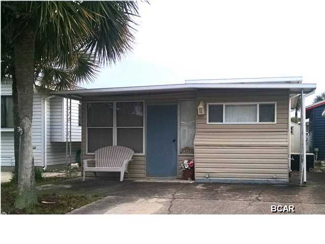 Here is your very own vacation home or rental investment! A great unit with all the space you need to spend a relaxing time at the beach, with storage space! There are two comfortable-sized rooms with beds, but the second space does not include a closet and cannot be counted as a bedroom. The large bathroom is conveniently located between both rooms, providing easy access. This property comes furnished with the essentials, making your transition to ''beach life'' as stress-free as possible. Whether you're familiar with Venture Out Resort or new to the family-friendly golf cart community, this is a considerable opportunity to have PRIVATE access to the World's Most Beautiful Beaches and Grand Lagoon, a playground with swings, TWO saltwater pools, tennis, basketball, AND shuffleboard court a fishing dock, a boat launch, and more! This unit has a BRAND NEW A/C unit, purchased Sept.2015, and the entire roof has been sealed, with a 50 year warranty. The property is a MUST SEE in Venture Out's market.