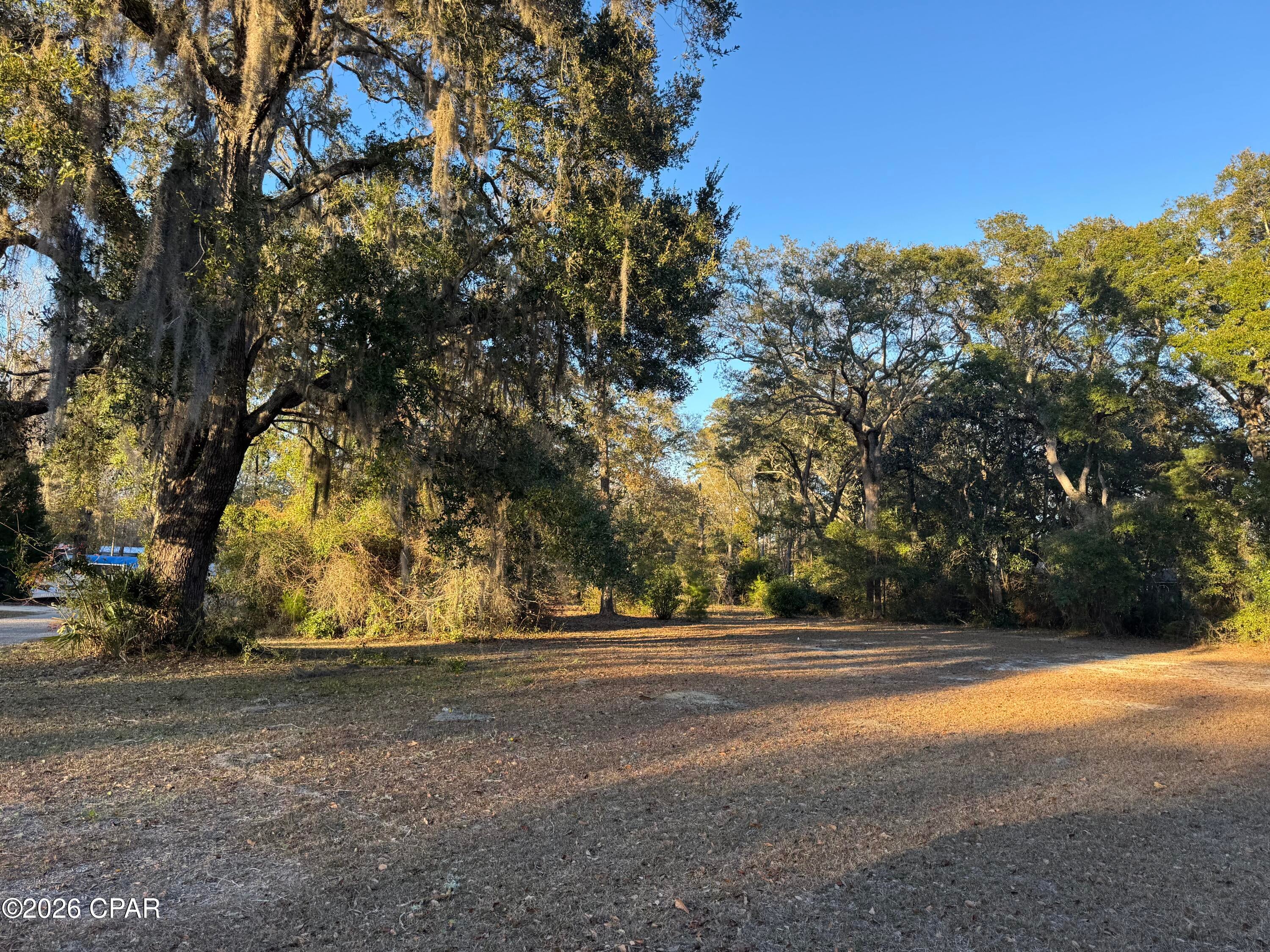 Beautiful half acre lot ready for your fish camp getaway!  Location is at Steelfield Fish Camp in Walton County, just 25 min from Pier Park off Hwy 79.  Steelfield Fish Camp is one of the most beautiful and peaceful places in NW Florida.  This community is paradise for someone looking for a place to access the Choctawhatchee River, surrounded by hunting land, close proximity to the InterCoastal waterway with riding leases for your side-by-side and plenty of other activities to fill your days!  This lot is raw land with beautiful heritage oaks and wild gardenia bushes.  No well or septic yet!  Additional adjacent quarter acre available (different owner)
with a 25 x 40 Storage barn on it if you need more space!