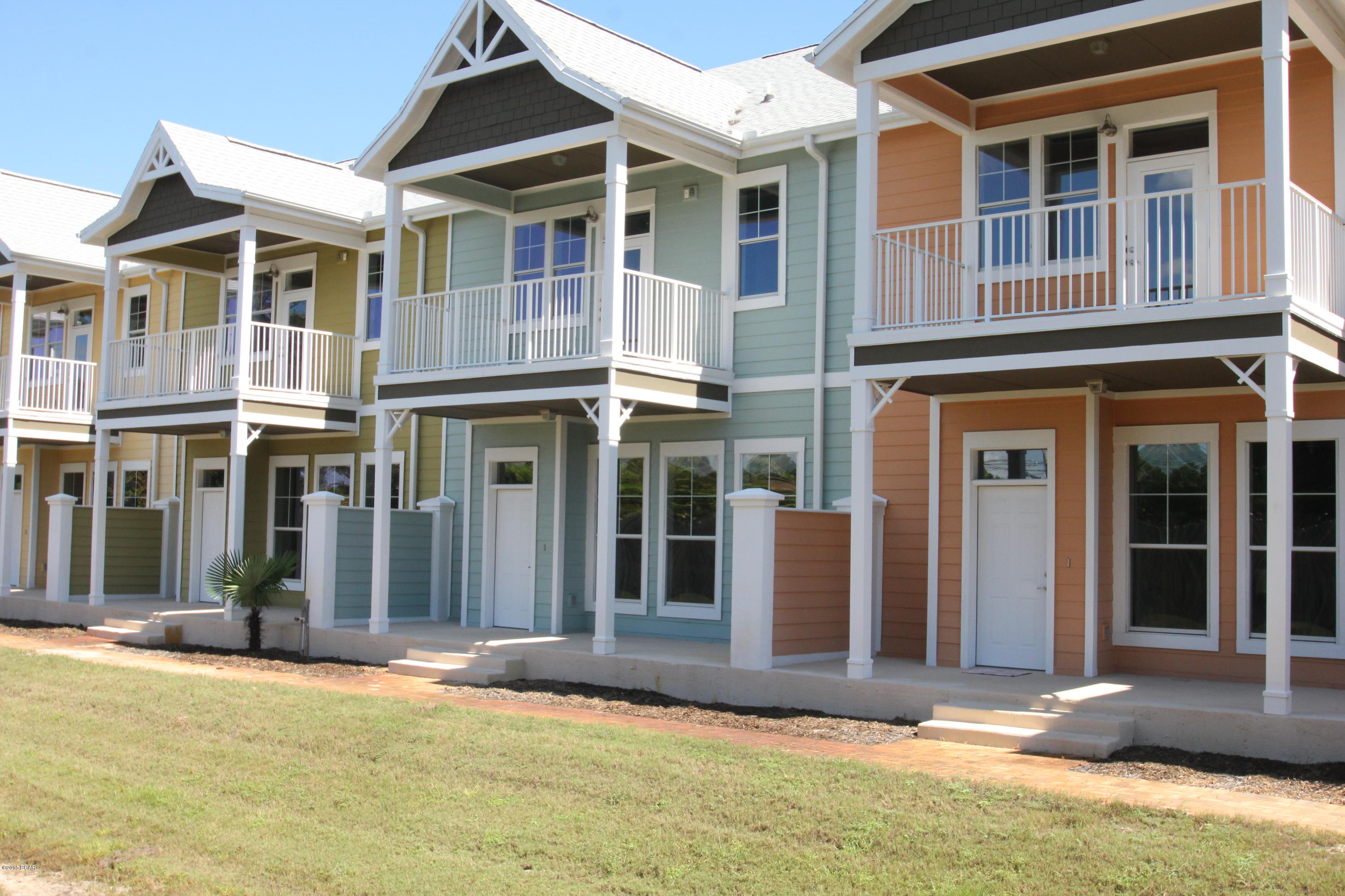 Its like owning a Home without any maintenance. These townhomes have all the same great amenities and luxury that you would expect from an upscale community like Island Reserve. These beautiful two-story townhomes boast 3 bedrooms, 3.5 baths. Every bedroom has its own Bathroom with 2200 square feet of H/C living space. Each townhome has its own double car garage, front and rear entries, first floor patio, and second floor balcony just off the Master Suite. Open concept layout with a large living room equipped with arched openings leading you into the dining room and kitchen. Living room is 20x18 and features a built in wet bar with matching granite countertops, and an owners closet. The kitchen is magnificent and has beautiful granite countertops, custom cabinets, brand new stainless steel appliances, an island with bar seating, and an oversized pantry. The dining room adjacent to the kitchen is large enough for everybody and is lined with windows looking out to your private courtyard, thus allowing plenty of that natural Florida sunlight to shine through when you want it. Down the hall connecting the garage to the kitchen is a good sized laundry room and half bathroom. Upstairs you'll find 3 bedrooms each with their own bathroom, but none more stunning than the Master Bedroom Suite. Master Bedroom is very spacious with a sitting area near the entrance and your own private balcony overlooking the back of the complex. Master bath features a double vanity with granite tops, a big garden tub, separate shower and separate toilet area, as well as an enormous walk-in closet. Down the hall are the other two bedrooms both of which have good size and their own full private bathrooms. The Island Reserve complex has just as much to brag about as these townhomes. Throughout the complex you'll notice the beautiful fountains and lush landscaping as you make your way down to the pool, hot tub, or clubhouse area. The pool is perhaps the largest in Bay County with two waterfalls, a zero entry area, and a lap area for those who like to swim after a nice workout. The pool deck is equipped with plenty of tables and chairs for your convenience and there is also a separate restroom facility close to the pool so you don't have to go back to your townhome just to use the bathroom. Next to the pool is a separate Splash Pad area for the kids. Inside the Clubhouse is a heated and cooled indoor basketball court, as well as a state of the art fitness center with free weights and machines. On your way to the clubhouse you might run into one of the many friendly security guards who man this property day and night keeping everything in order. Island Reserve is a great community whether you are single, raising a family, or retired. Everybody is friendly and there is a strong sense of community here. If you want the best here at Island Reserve look no further than these brand new townhomes. These won't last long at this price. Resort Living close to everything in Panama City Beach. Beach is 1.4 miles away or 4-5 minute drive from Island Reserve. Please see in documents how you can save over $3000 per year here at Palm Villas compared to a similar home not in the Island Reserve community.