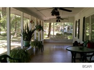 Looking for the PERFECT fishcamp! You will LOVE Howard Creek! This quaint golf cart community sits between Wewahitchika and Port St. Joe and has some of the best fishing in Florida, easily accessable to Apalachicola River and Lake Wimako. This home is a modified mobile home, but don't let that scare you off.. it is very clean and well kept with lots of vintage charm. You will love relaxing after a day of fishing in your porch-swing on the huge screened porch overlooking the beautiful yards. Lot is fully fenced. Home features a deep well and concrete septic and has just had all electric updated. Check out the additional photos to get a feel for this great camp located just around the corner from the boat landing with its RV park, and country store!