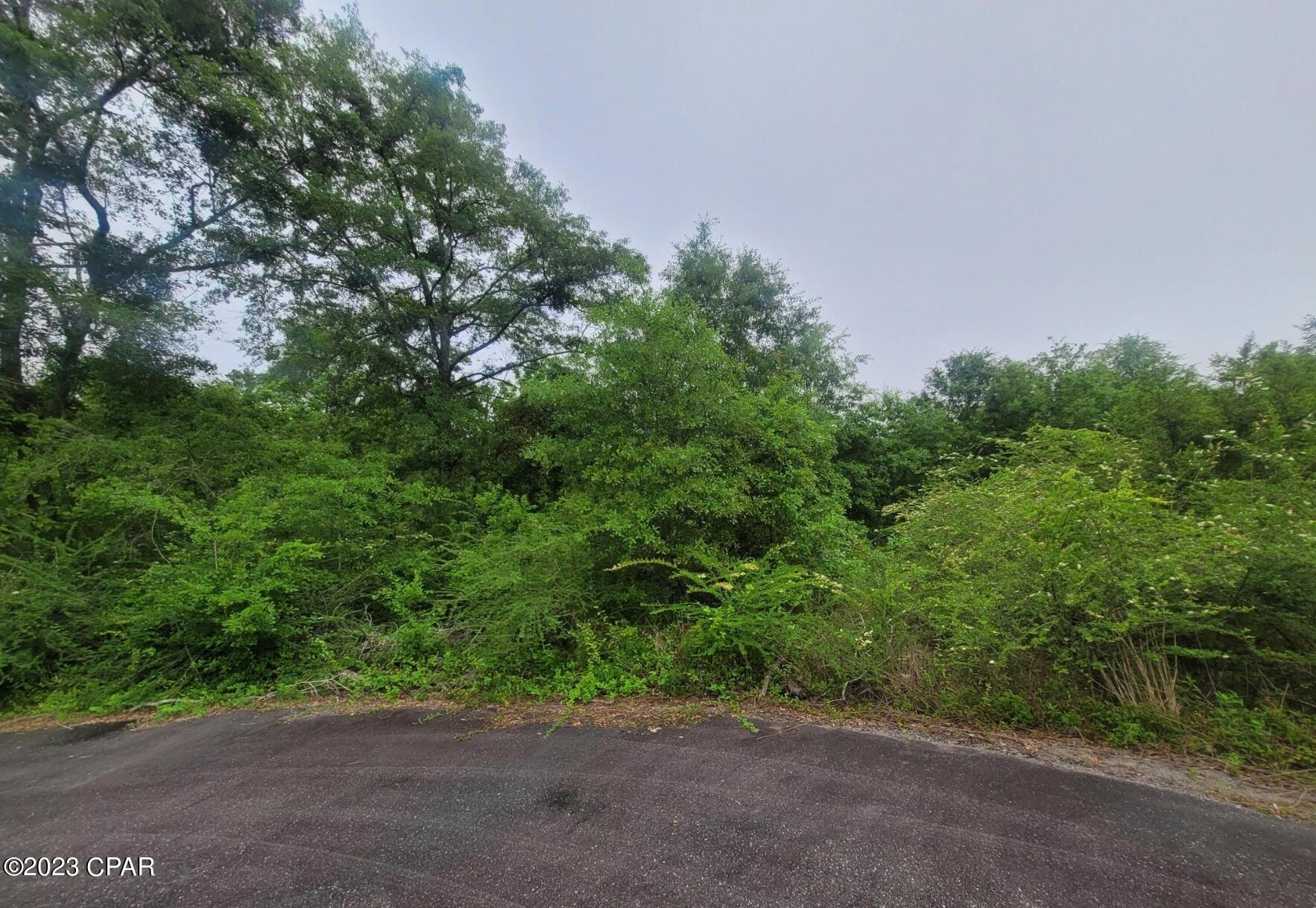 Double lot in Bohoma Acres. Lot is mostly wooded and located on a cul de sac. Paved road frontage, not far from town. Restricted to site-built homes only. Extra large lot is ready for your dream home.  Well and septic is required.