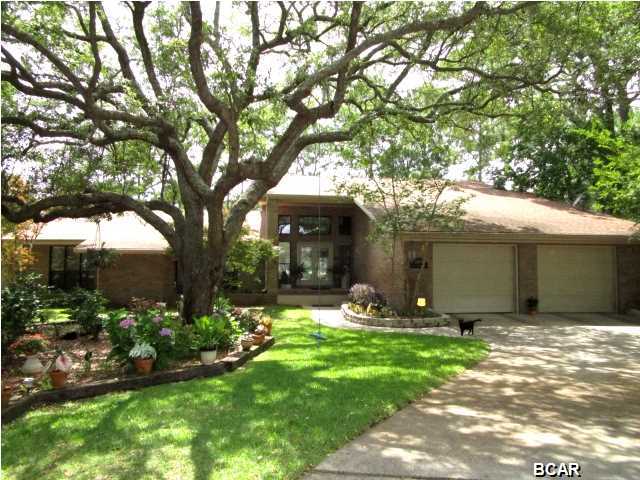 ABSOLUTELY STUNNING ALL-BRICK HOME nestled in the desirable Kings Harbour neighborhood in Kings Point! From the beautiful foyer entrance, the home features a spacious living room with hardwood floors and a barrel-style wood ceiling, large windows for loads of light, and a spiral staircase to a second floor recreational room that could also be used as a fourth bedroom as it has a large walk-in closet. The Master bedroom with its hardwood floors has a brick fireplace and two separate Master baths. The main bath has two walk-in closets, a whirpool tub, vanity and dressing area. A separate room off this bath has a tiled shower and second vanity. The kitchen has been updated with granite counters, stainless appliances and overlooks a dining area with a bay window and separate built-in desk/counter area that also serves as a pass-through to the living area. From the dining area, you will step down into the Sun Room that offers access to the 42-foot long screened porch that encloses the in-ground pool. Or you can step outside this screened porch and enjoy the wood deck that overlooks the pond for ultimate serenity. Outside, there is also a 9.5' x 7' room that houses the pool pump and has shelves and some room for additional outside storage. This home is a must-see to appreciate the uniqueness of this property!
