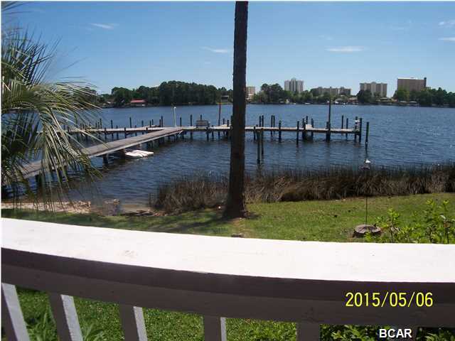 Watch the dolphins right from your balcony! The views are amazing from this waterfront condo. This is a wonderful complex with a boat dock and gulf access. The complex offers a pool, a breezeway for gatherings, is pet friendly, has a new roof and is very well maintained. This ground floor unit is move in ready and can be purchased with furnishings. It is a minute from the worlds most beautiful beaches and close to restaurants, shopping, St. Andrews State Park, the Navy Base, Pier Park and all that Panama City Beach has to offer. It is perfect for retirees, a vacation condo, an investment property or a first home. All this and priced below $100,000.00.