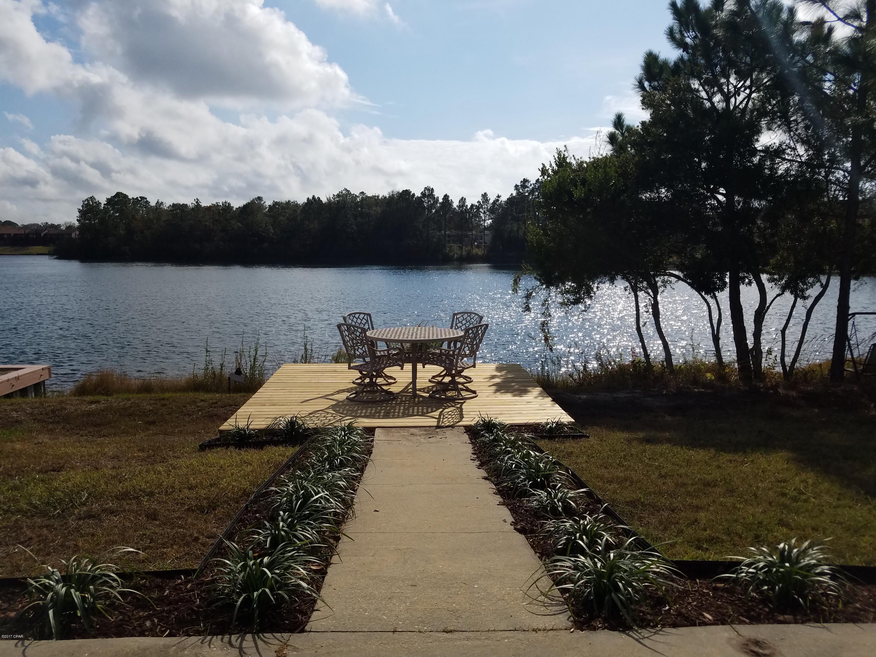 For rent. Immaculate 3 bedroom, 2 bath home overlooking Lake Marin in the heart of Panama City. Capture beautiful sunset views of the lake from the new deck or screened porch. The home features an open floor plan kitchen overlooking dining and living room. Recently updated, the kitchen features great cabinet and counter space, and new stainless appliances w/ refrigerator, stove/oven, dishwasher, and vented microwave. There is a breakfast nook attached to the kitchen where the washer/dryer closet is also located. Small patio convenient to kitchen. Large dining/living room w/ tray ceiling and natural lighting. The master bedroom is on the lake and has a tray ceiling, walk-in closet, en suite bathroom with shower. INCLUDES Lawn Service & Irrigation Water! Two car garage; **No pets allowed. ** *Irrigation water included in rental