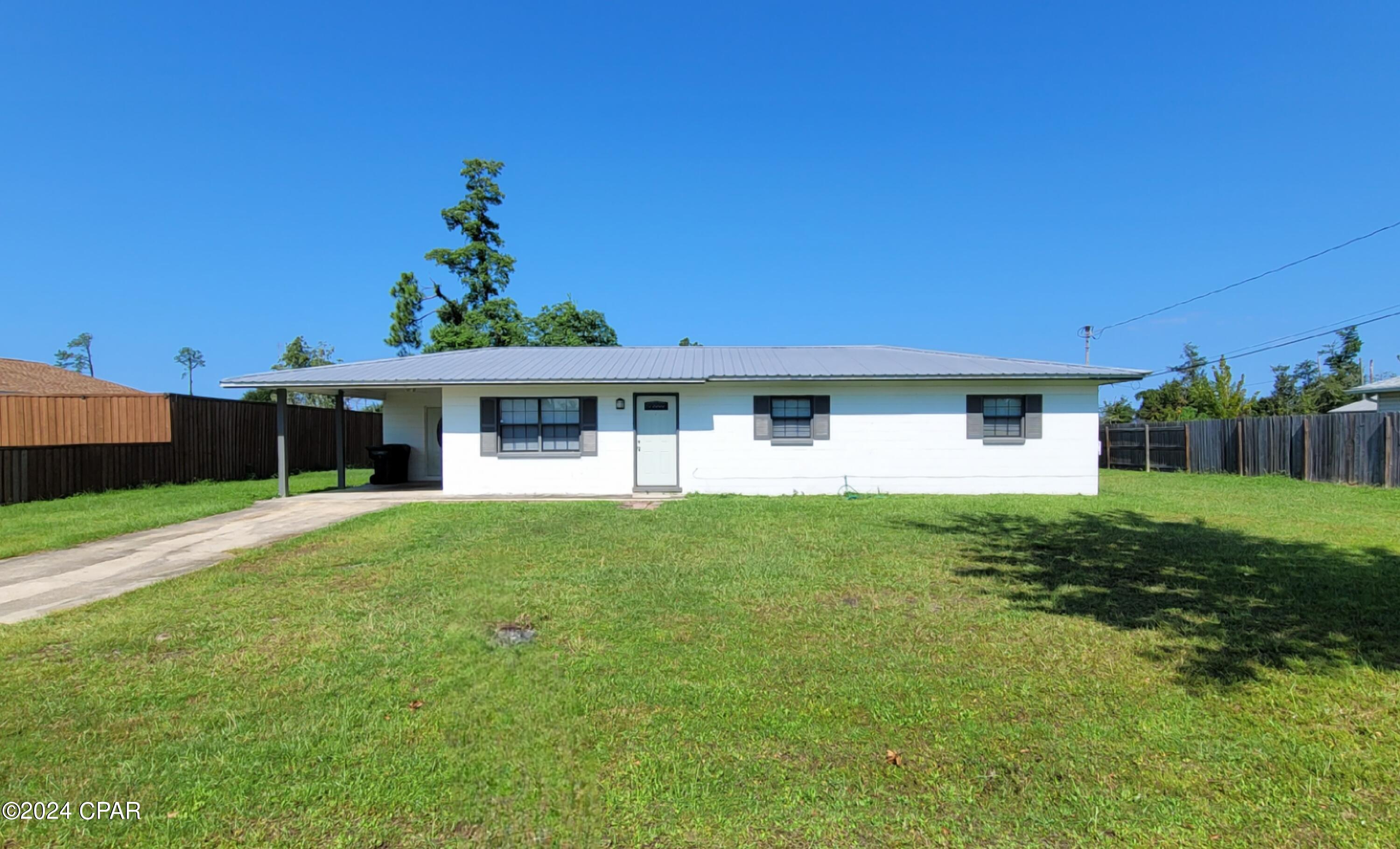 Lynn Haven! Cute 4 bedroom/2 bath home with 1 car garage with driveway parking. This home features LVP & Tile flooring throughout, spacious eat in kitchen with sliding glass doors to open patio, large yard and storage room off carport with W/D hookups.  All Electric!
Lawn service included twice a month.
1 small dog under 20 lbs.
$50.00 pet fee
$250.00 pet deposit
$25.00 per rent per month