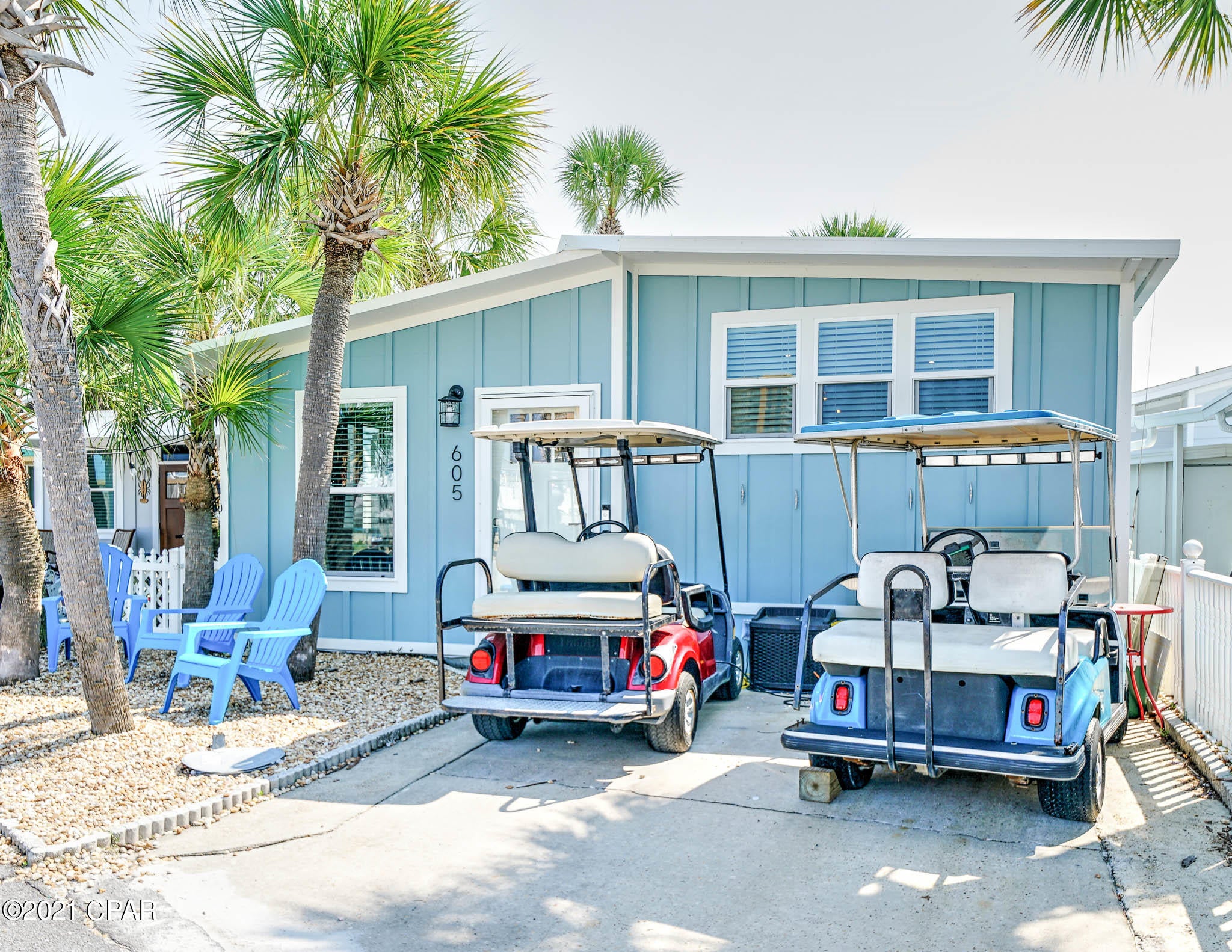 CURRENTLY UNDER CONTRACT, SELLER ACCEPTING BACKUP OFFERS - Excellent opportunity to own in highly sought after Venture Out! Check out this darling 2 bedroom 2 bath home with bunks complete with their own flat screen tv's! You will love the open floor plan and all the beachy touches.  The living room has fantastic high ceilings and kitchen has all the upgrades you have been looking for including large farmhouse sink.  Great for investment or make this your second home. Venture Out is a golf cart community that has exploded with popularity recently... With 300' on the beautiful pristine beaches of the Gulf of Mexico and 1,000' on the Grand Lagoon. Venture Out has something for everyone. With 2 pools, fishing pier, boat ramp, mini golf, children's play ground and much much more!