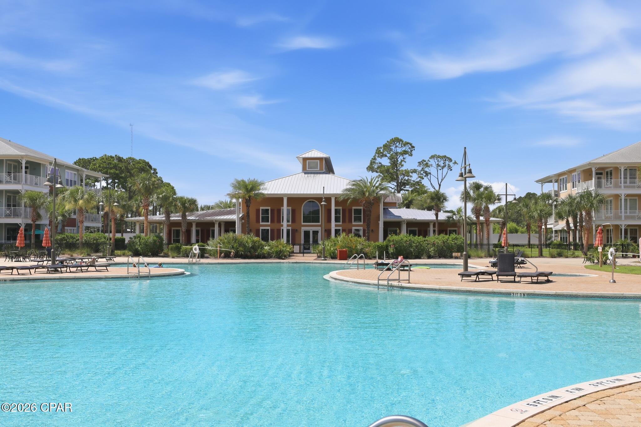 This stunning home is a short 1.4-mile golf cart ride to ''The World's Most Beautiful Beaches!''
Welcome home to paradise and true resort-style living at Island Reserve, one of Panama City Beach's most vibrant Caribbean-style communities!  You will absolutely love this beautifully maintained condo and its pristine community!
This spacious, beautifully designed home features two private primary suites, each has its own en-suite bathroom with a tiled walk-in shower, a generous walk-in closet, and direct access to the extra-large balcony. From there, you can overlook a well-manicured, lush tropical courtyard complete with fountains and a pool view. Inside, you'll find a perfect blend of luxury, elegance, sophistication, and comfort. Double French doors in the living room and French doors in each bedroom provide an abundance of natural light and open seamlessly to the balcony. The interior boasts gorgeous granite countertops throughout, warm wood cabinetry, stainless steel appliances, and soaring 10-foot ceilings accented with crown molding. Every detail exudes timeless elegance.

This updated home is loaded with premium upgrades:
- Brand new Top Tier HVAC system with all the latest technology and equipment
- Freshly painted throughout including ceilings, walls, trim, and doors.
- Brand new water heater
- All wire shelving removed and custom closets installed
- Walk-in pantry for added storage with custom built closet system
- New fans and lighting
- All wall ceiling vents and switch plates replaced
- Elegant Plantation shutters throughout
- Custom kitchen pull-out drawers
- All carpet removed and replaced with bamboo flooring and ceramic tile
- Stunning tile shower and tile accents installed around the soaking tub
- Custom framed mirrors in both bath areas

This premier gated beach community is loved for its true resort-style atmosphere and unparalleled Amenities!
- Stunning and massive 1-acre Lagoon Style Pool featuring two waterfalls and outdoor hot tub.
- Covered Parking: Drive right up into the covered garage and walk directly to your front door on the same level-no stairs and no waiting for elevators required! (Elevators and stairs are also available in all buildings for your convenience). 
- Community Clubhouse & Game Room: Includes a full kitchen and a dedicated theater room, Fitness center, indoor basketball and pickleball court. 
- Lush tropical landscaping gardens and water fountains that provide an outdoor sanctuary and make everyday life feel a little more like you're on vacation!
- Vibrant and Socially Active Community: Known for its peaceful atmosphere and an active Social Club that hosts regular community events, live music by the pool, and holiday parties, creating a true neighborhood feel. 
- This gated community offers residents true peace of mind with a security officer, controlled access, security cameras throughout community, and perimeter fencing to ensure privacy and safety in a resort-style environment.
- Golf Cart Community 
- Pet-friendly walking areas and pet stations
- Short-term rentals are not allowed, ensuring a quiet and peaceful environment year-round without the chaos of vacation rentals

COA/HOA Inclusions:
- Water
- Sewer
- Fiber Internet
- Trash
- Grounds/landscaping
- Amenity maintenance
- Clubhouse/community facilities
- Exterior maintenance and repairs
- Pest control in common/shared areas
- Security 
- Master Insurance Policy, hazard, windstorm, exterior structure, and property insurance. While the master insurance covers the exterior and core structure, unit owners must still carry an HO-6 insurance policy to cover interior finishings, personal property, and individual liability.
- Flood policy for each building
- Maintenance/management-related expenses
- Reserves/reserve funds

Nestled on the top floor (3rd floor), you will enjoy gorgeous views with the ultimate peace of mind of having no neighbors living above you! Whether you're searching fo for a full-time residence or a refined coastal escape, this Island Reserve home delivers on every level. Enjoy low-maintenance coastal living near beachside and waterfront dining, shopping at Pier Park, golf courses, and the beach! This condo has the perfect balance of excitement and serenity. You aren't just buying a condo; you are buying an upscale resort lifestyle!
