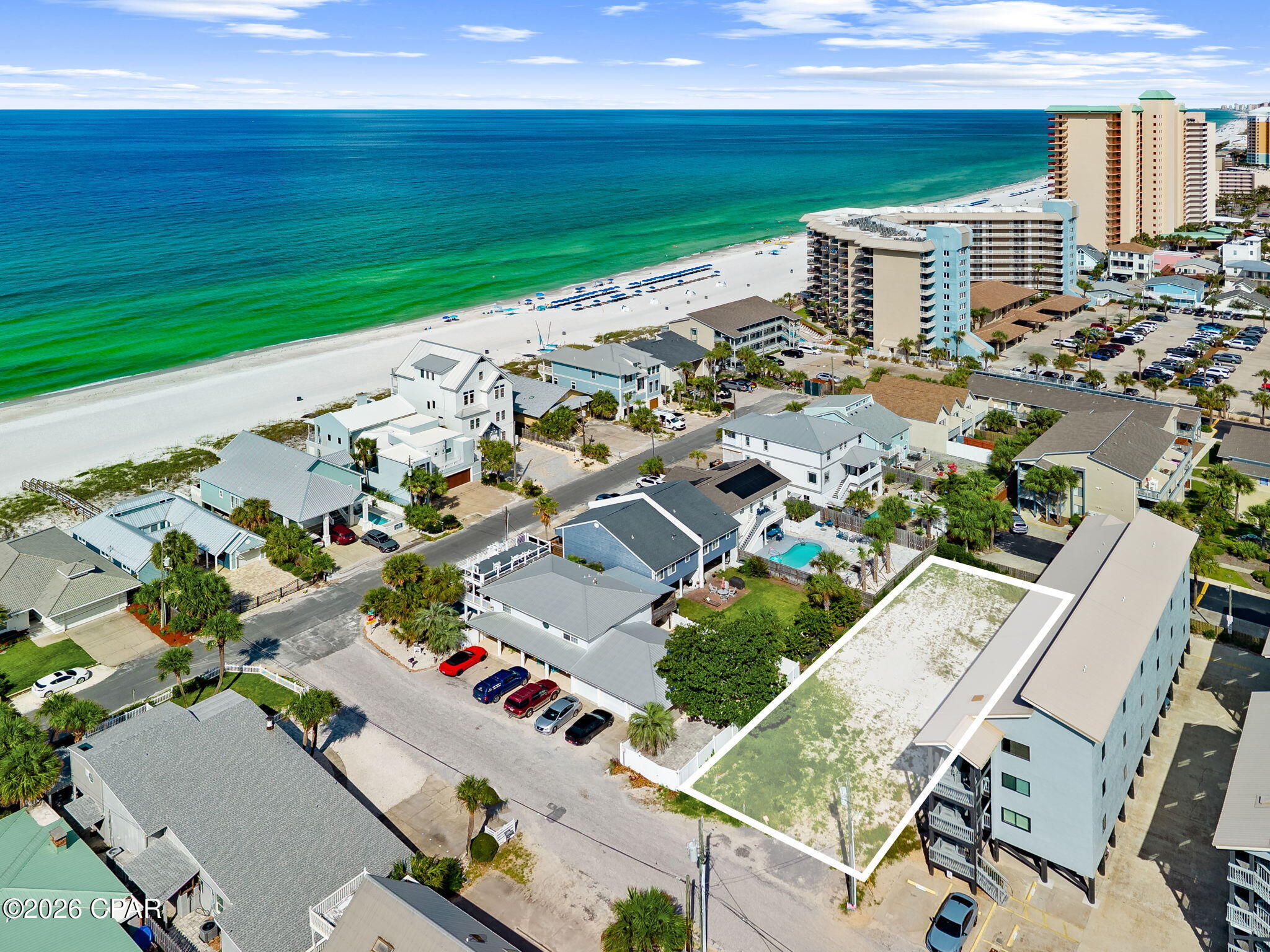 RARE DEVELOPMENT OPPORTUNITY JUST STEPS FROM THE BEACH! This approximately 7,405-square-foot, 50' x 150' lot in the highly desirable Holiday Beach area offers an exceptional opportunity to build in one of Panama City Beach's most sought-after coastal locations. The property is located in Holiday Beach Unit 9 and is zoned SR-2.

The lot is high and dry and located in Flood Zone X, providing an attractive starting point for future development. Public water and sewer are available, and the property fronts a paved county-maintained road. There is no HOA associated with the property and this lot presents an excellent opportunity for develop of high-income vacation rental or a multi-unit investment.

Enjoy an outstanding beachside location with the Gulf of Mexico and the beautiful white-sand beaches of Panama City Beach just steps away. The surrounding area offers convenient access to restaurants, entertainment, shopping, boating, nightlife and other popular Panama City Beach attractions.
Don't miss this incredible opportunity here on World's Most Beautiful Beach!