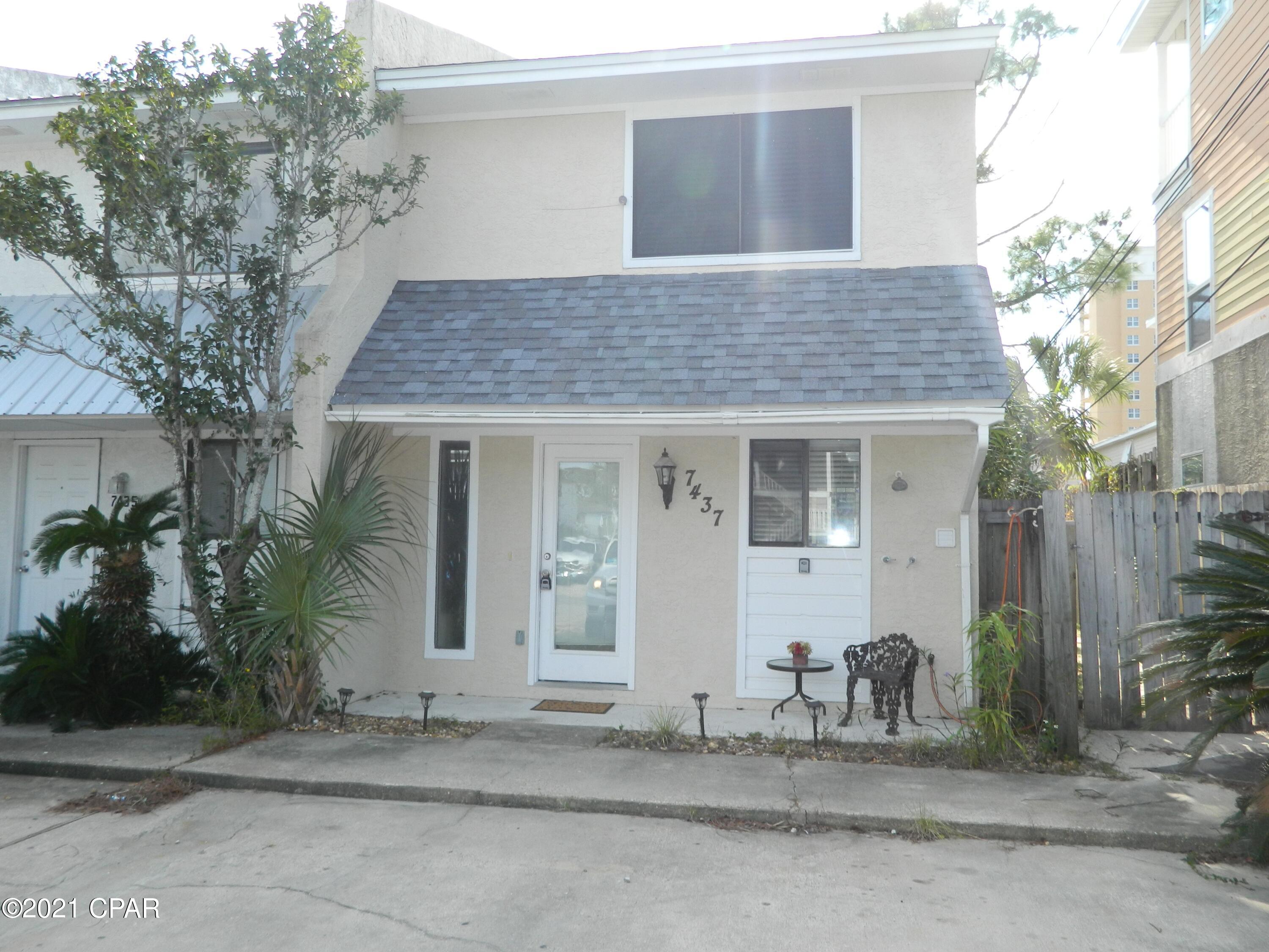For rent. Furnished town home conveniently located off Thomas Drive and within walking distance to the beach. Interior features include tile downstairs and a gas fireplace in the living room. Master bedroom has a king size bed and features a balcony that overlooks the backyard. Guest bedroom has a full size bed. The backyard is fully fenced. Small dog negotiable with $250 non-refundable pet fee, no cats. Stacked washer/dryer included. Tenant pays all utilities.