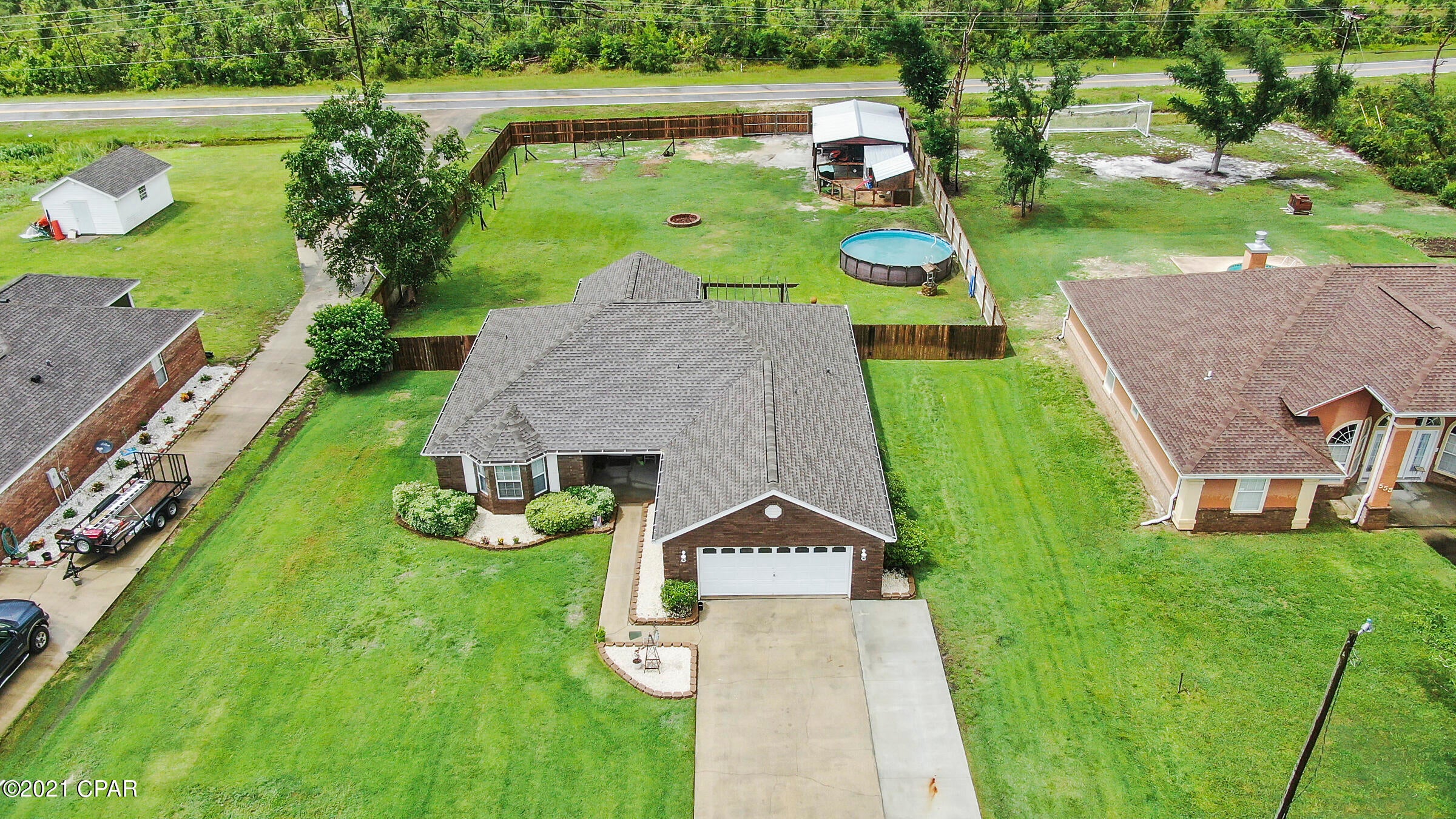 'CURRENTLY UNDER CONTRACT, SELLER ACCEPTING BACKUP OFFERS'Check out out this 3bd/2bth home, situated on half an acre with fully fenced back yard and double-gated access. Enjoy the country living, but just within a short 15-minute drive in town or quick commute to Tyndall AFB. 

This home features many new updates to include new roof, new HVAC air handler/condenser and extended driveway (2018) to start. Split bedroom floorplan offers open concept with updated kitchen appliances (2018) and new LVP flooring throughout(2021). Spacious master bedroom is located just off the kitchen, with a walk-in closet and a master ensuite which offers double sinks, garden tub and seperate shower. Great natural light can be found in the two bedrooms, offering plenty of room for family or guests. Step outside onto the covered back patio which Seller will include the materials needed to fully screen in. Large, fully fenced backyard offers endless possibilities for outdoor entertainment, gardens or even farm animals. Seller currently has goat/chicken pens (animals due not convey) in the backyard and can include as-is with the purchase. Seller is also willing to leave above ground pool as-is (needs new pump). Large shed with covered area located in the backyard did sustain damage from the hurricane, but is still usable and is included as-is. Double-gate access from County Rd 2297 makes it super convenient to store boats, campers, etc. in the backyard. Don't miss your chance to see this great property today! All sizes/measurements are approximate; please verity if important!