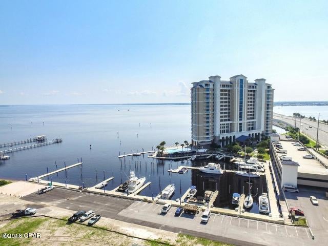 The view from the spacious private balcony overlooking St Andrews Bay will take your breath away. The balconies outdoor living area offers a built in summer kitchen with an electric grill that is  perfect for entertaining or enjoying a relaxing evening with you family and friends. This home offers two bedrooms, two full baths, floor to ceilings windows that provide a view of the bay from every room, cozy fireplace and a gorgeous kitchen. The kitchen offers granite countertops, abundance amount of cabinetry, stainless steel appliances and full pantry. This luxurious complex features bay front swimming pool and hot-tub, community room and fully equipped exercise room that over looks the water. The adjacent marina provides deep-water boat slips for rent. A boater's and fisherman's paradise.